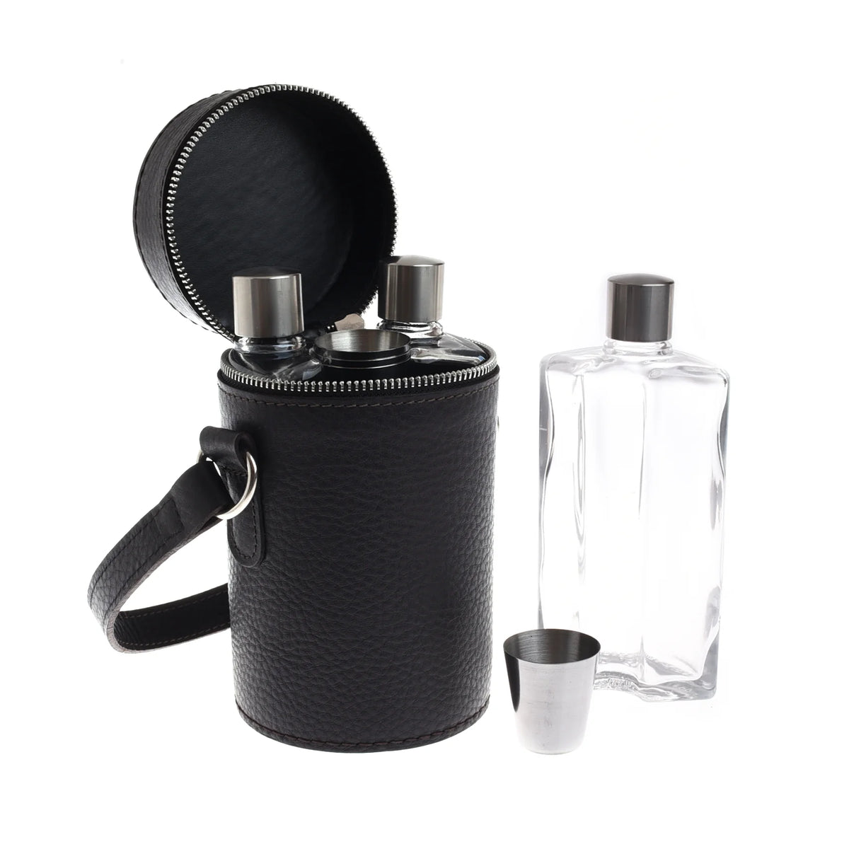 A cylindrical black leather carrying case for a Campbell’s of Beauly Triple Flask Set holds two glass flasks, with a third flask and a metal shot cup standing outside of it.