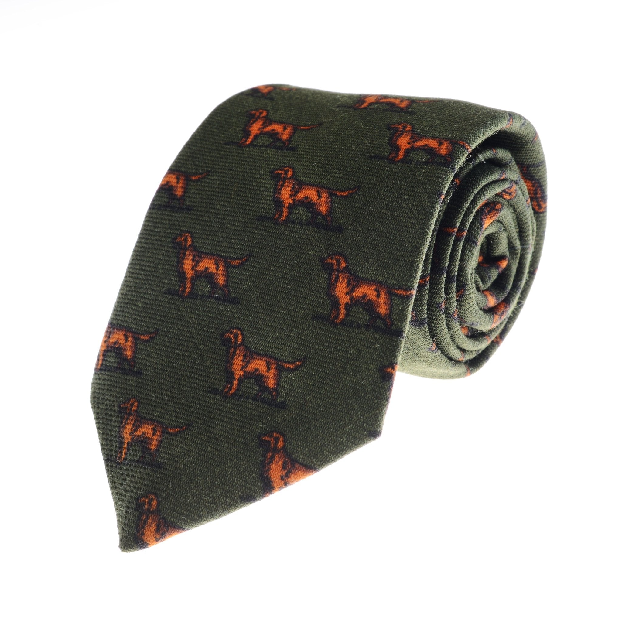 The Setter Dog Silk Tie by Campbell's of Beauly is an olive green silk tie featuring a repeating pattern of small brown and orange dogs, offering a charming countryside look.