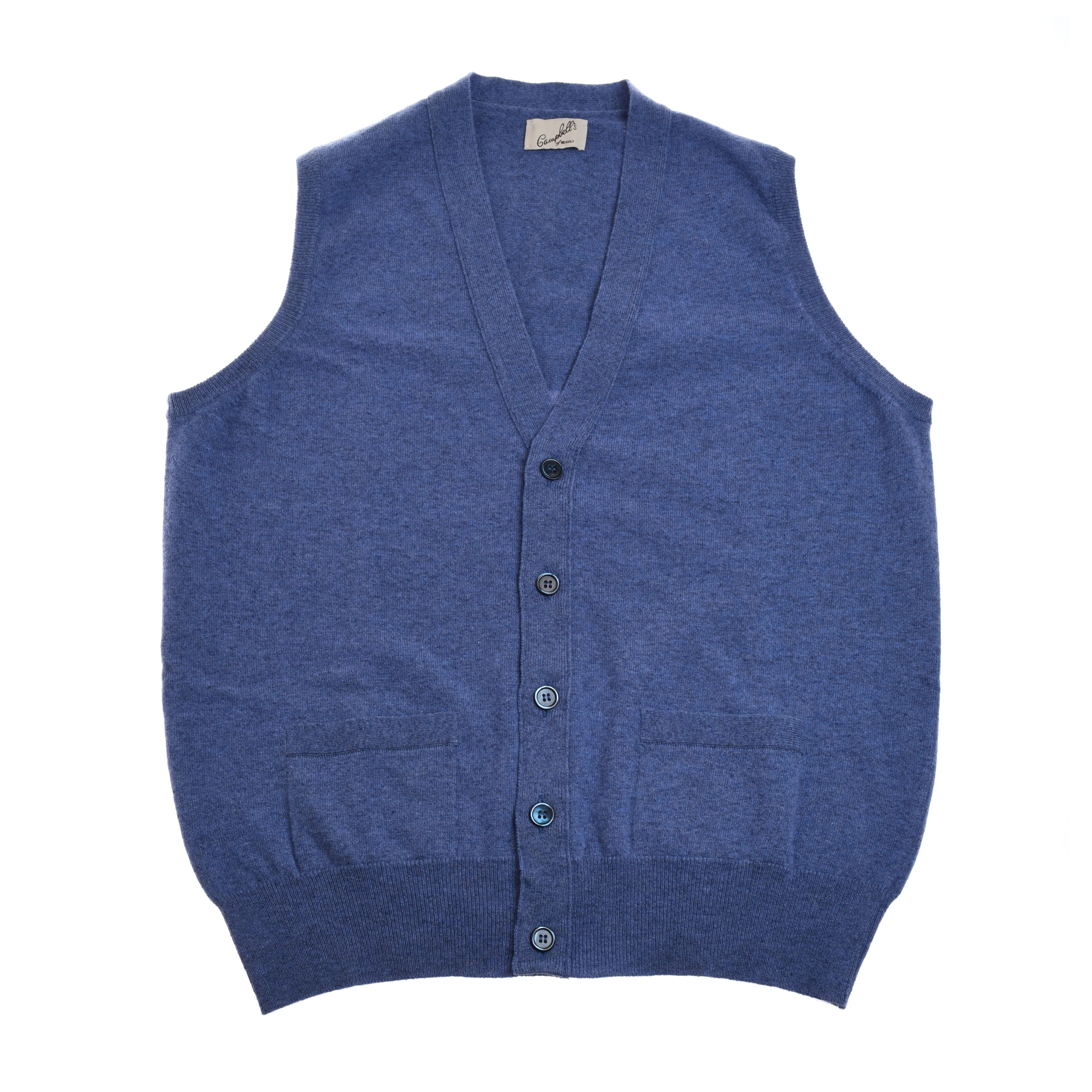 The Auld Stock Geelong Button Waistcoat by Campbell's of Beauly is a blue sleeveless V-neck knit with a button front and two pockets, shown laid flat on a white background—perfect for any country wardrobe.