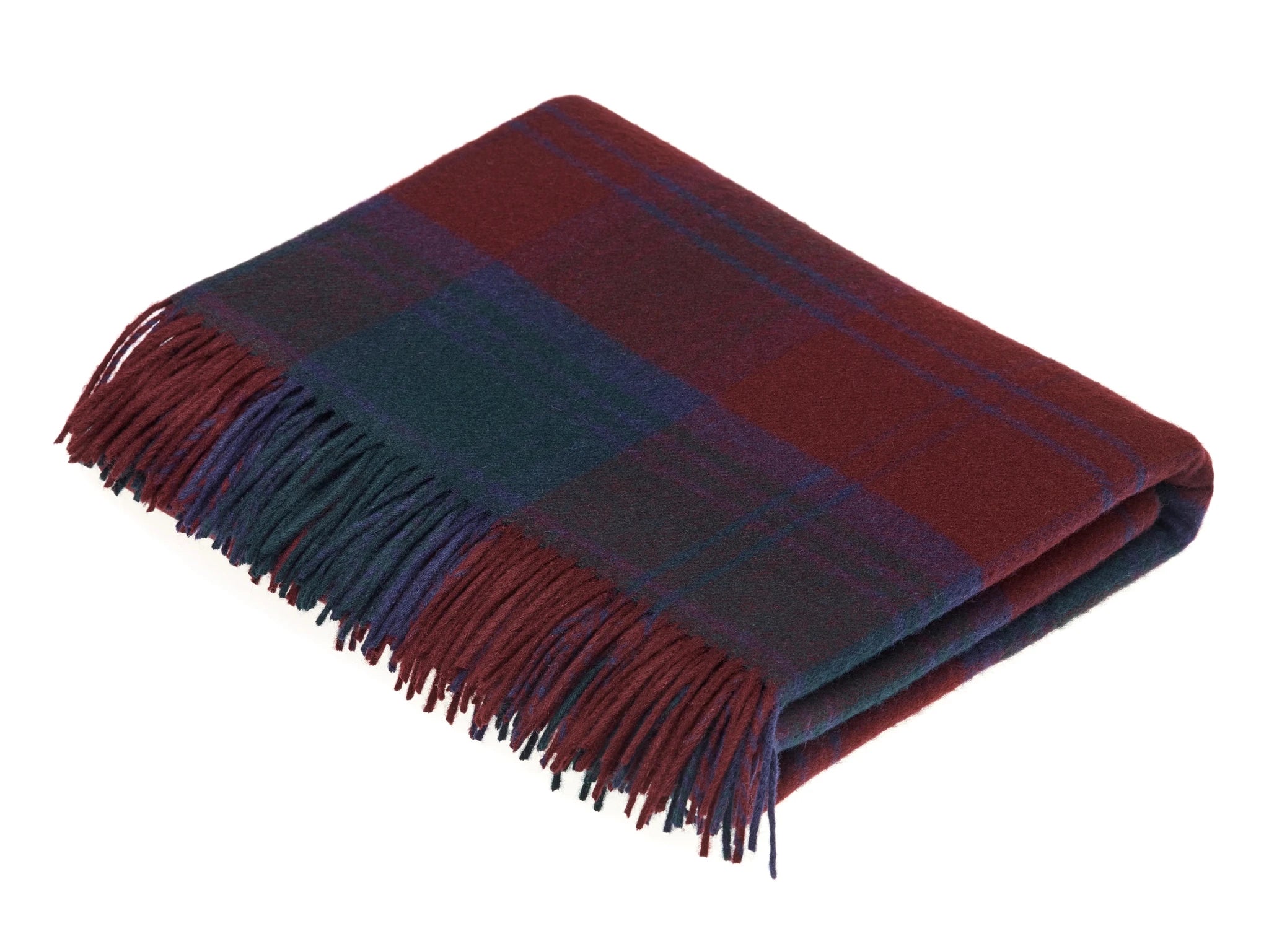 The Campbell's of Beauly Auld Stock Lambswool Blanket, made in the UK, is shown folded to highlight its dark red, green, and blue woven pattern with fringed edges.