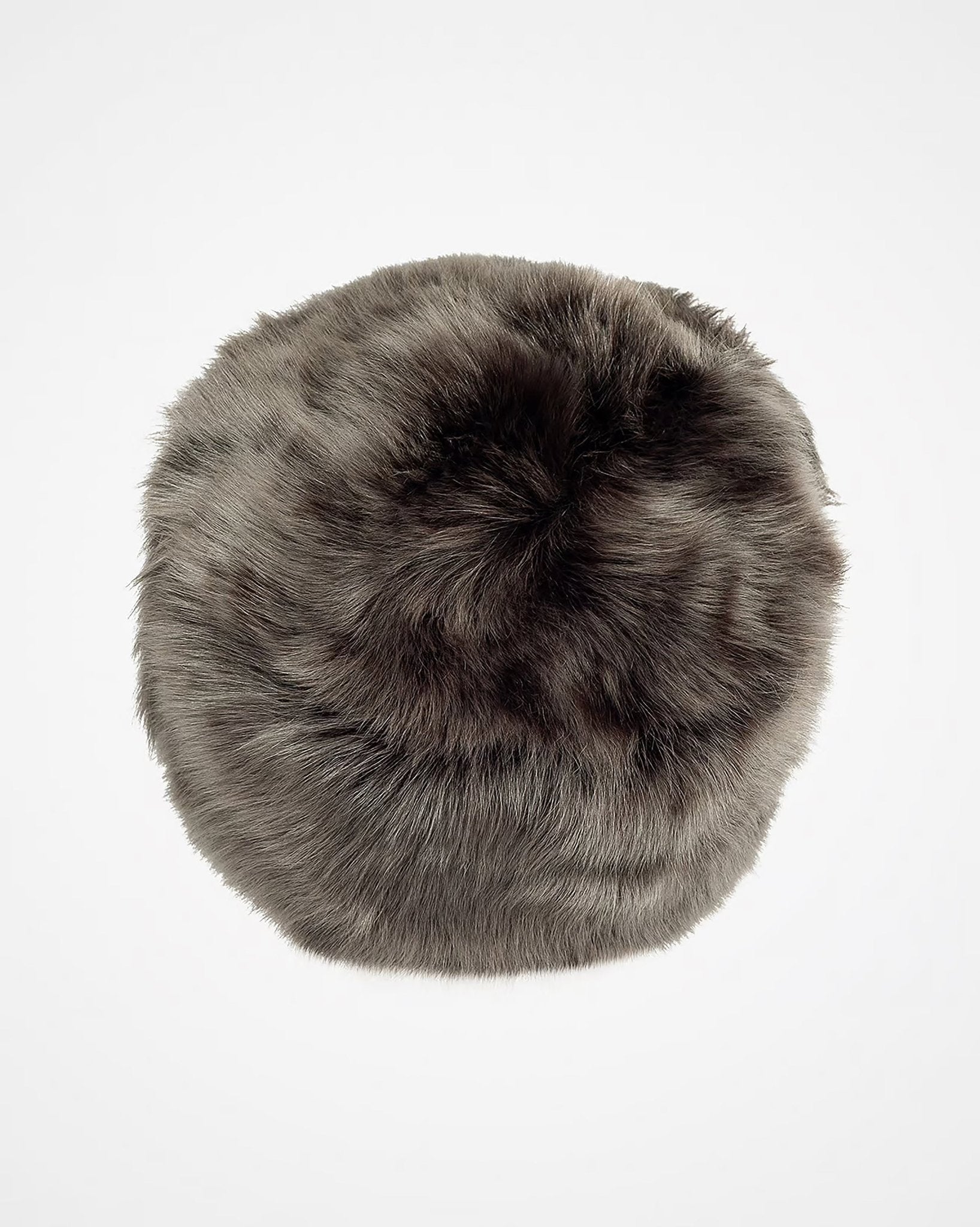The Campbell's of Beauly Pillar Box Hat is a round, furry winter hat made from thick, soft gray Toscana sheepskin, shown against a plain white background.