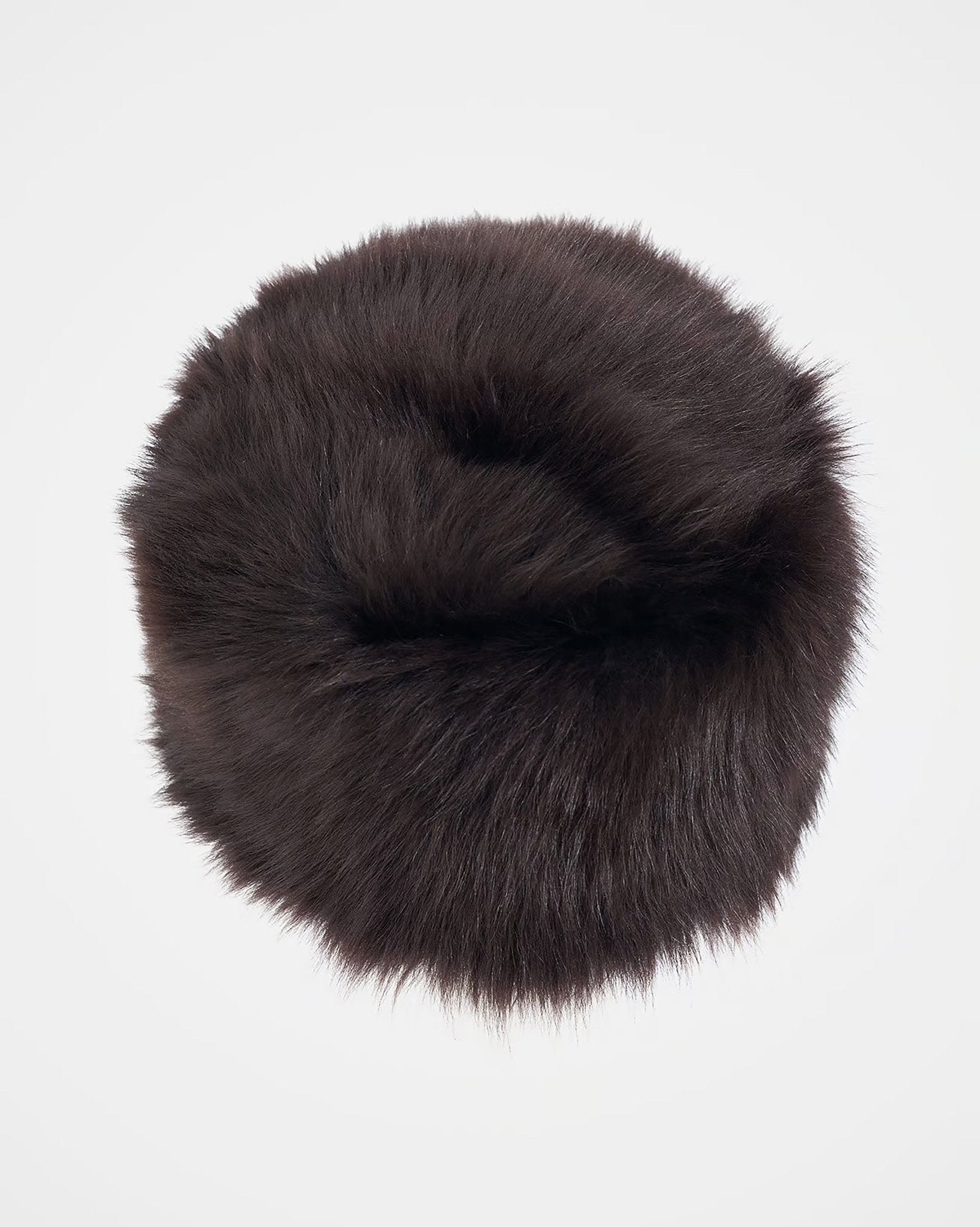 The Campbell's of Beauly Pillar Box Hat, a round, dark brown Toscana sheepskin winter hat with a fluffy texture and pillar box shape, is shown against a plain white background.