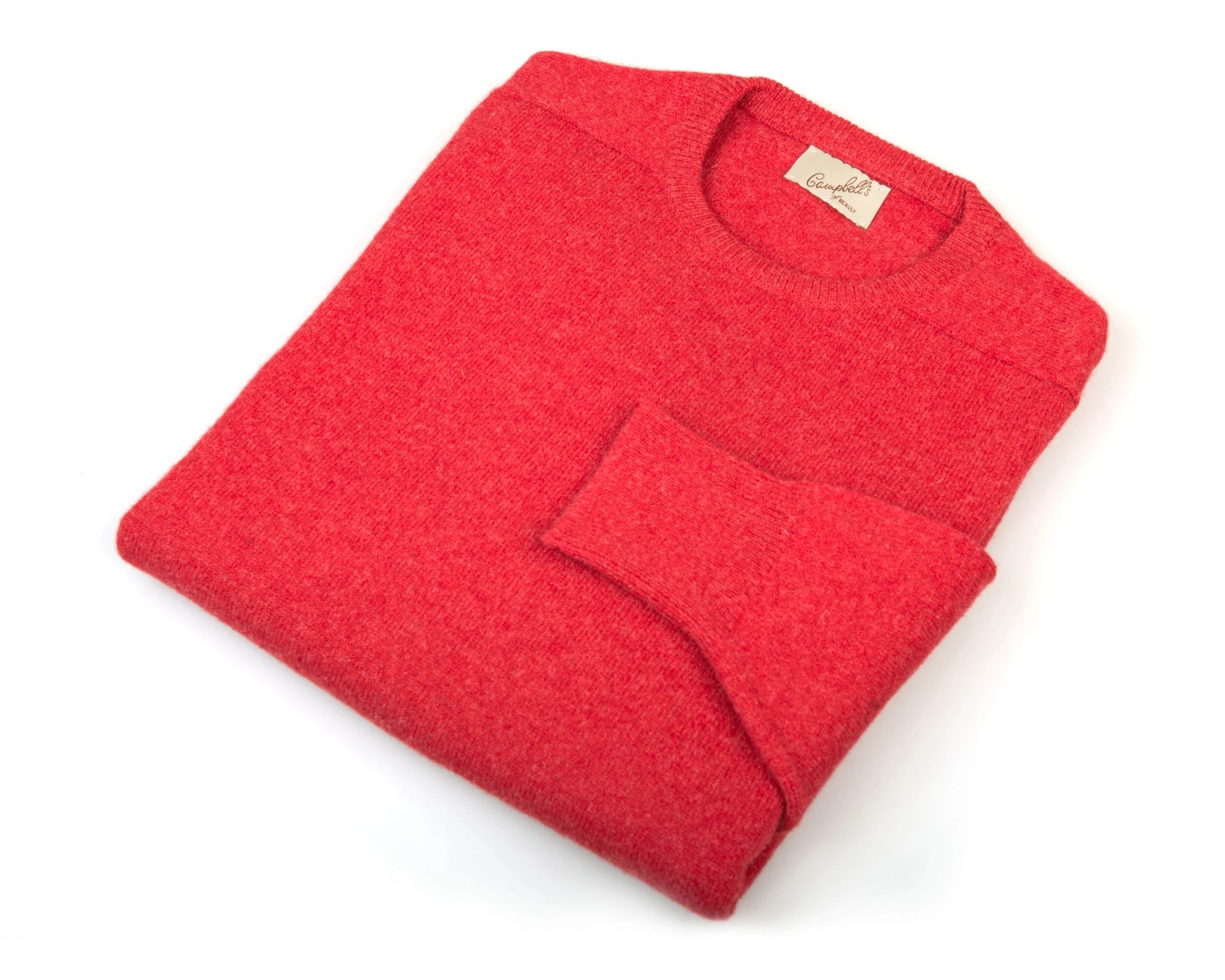 A neatly folded Auld Stock Lambswool Crew Neck Jumper by Campbell's of Beauly, with its tag visible on a white background—classic Scottish knitwear at its finest.