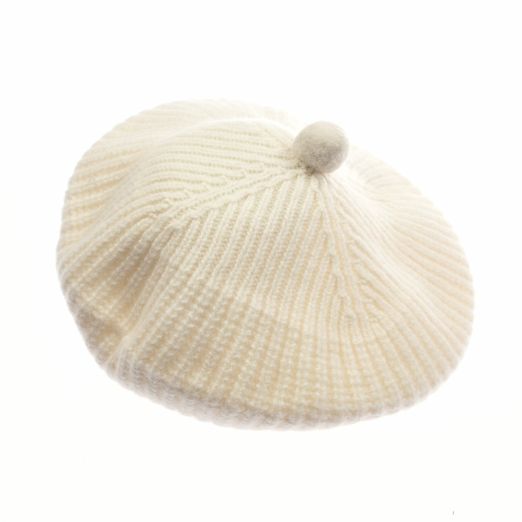 The Campbells of Beauly Rib Beret in taupe features a ribbed lambswool knit and a classic round knob on top, shown against a white background—an elegant, cozy choice for winter style.