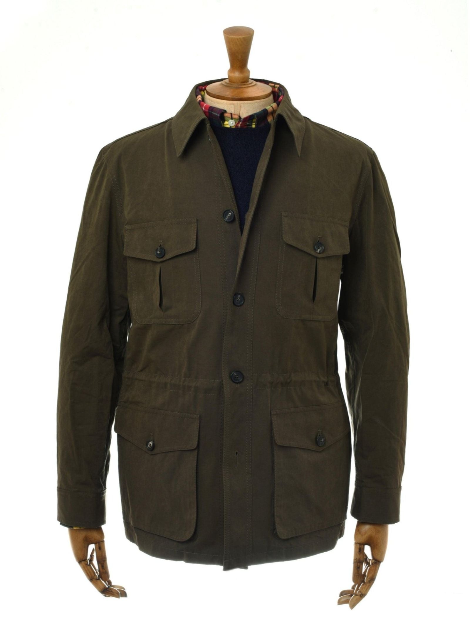 The Aigas Field Jacket by Campbell's of Beauly is a brown, long-sleeve Italian-style jacket with a collar, button front, and four large flap pockets in soft peach skin fabric, shown on a mannequin against a white background.
