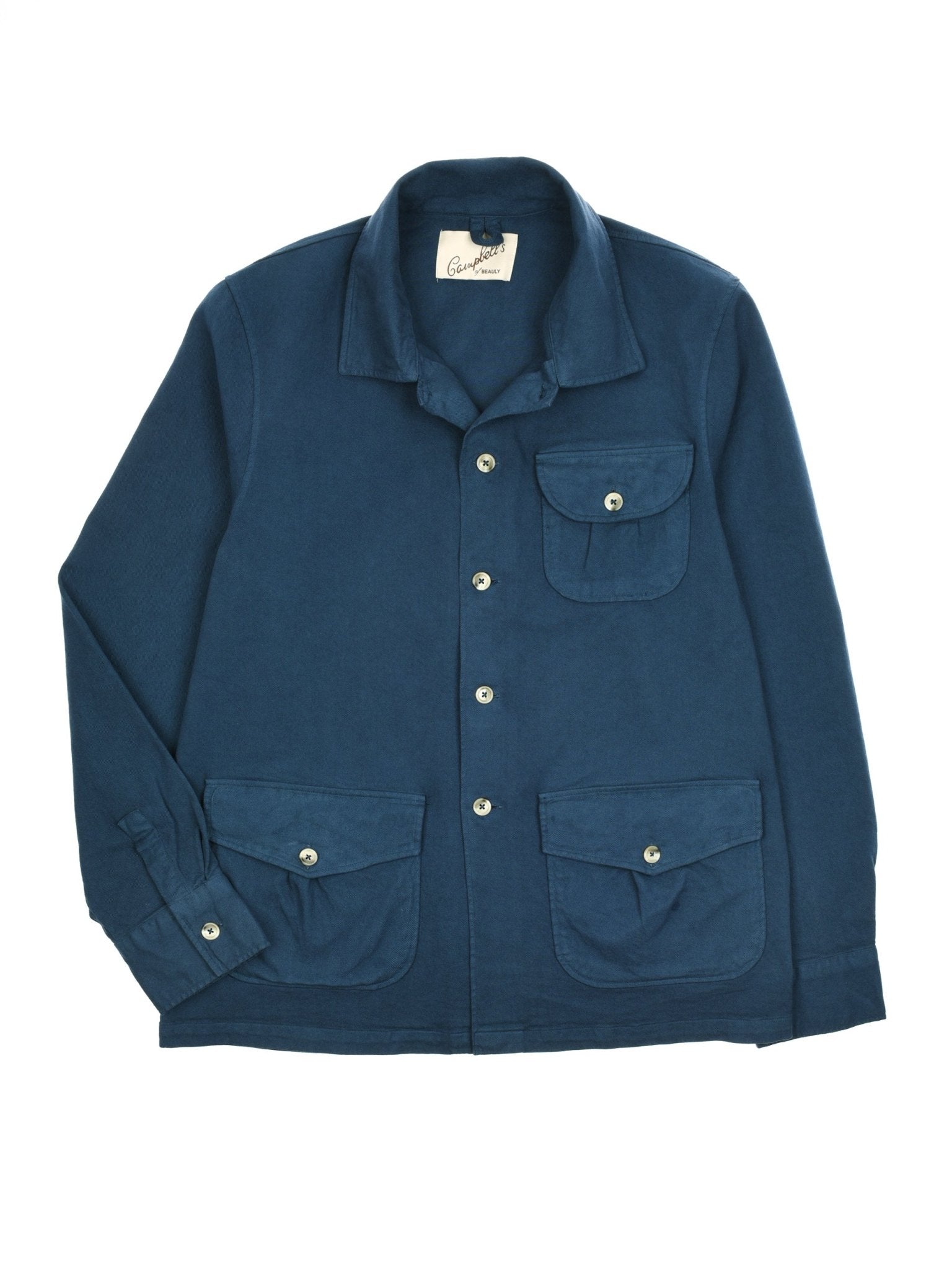 The Auld Stock Field Chore Jacket by Campbell's of Beauly is a blue European-made jacket with a collar and four button-flap front pockets—two on the chest, two lower.