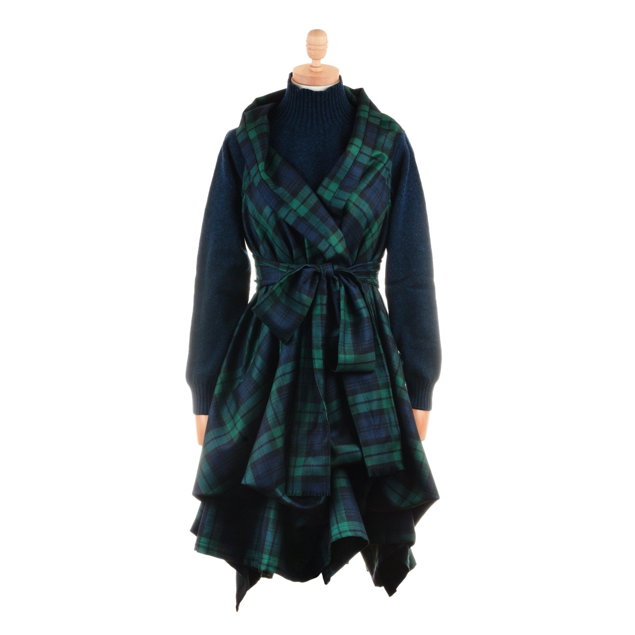 A mannequin displays a Campbell's of Beauly Reversible Wool Wrap Dress with a green and blue 100% wool tartan, layered wrap skirt, matching tie belt, and an asymmetric ruffled hem.