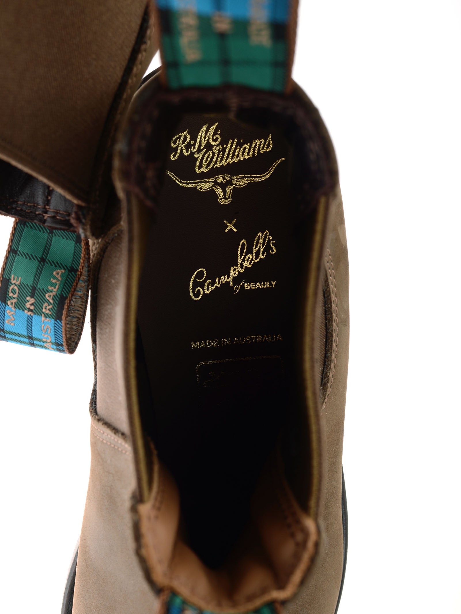 Close-up of the Ladies' R.M.Williams Highlander Boot from the R.M.Williams x Campbell's of Beauly collaboration, showing premium leather, gold branding inside, and a green plaid pull tab marked “Made in Australia.”.