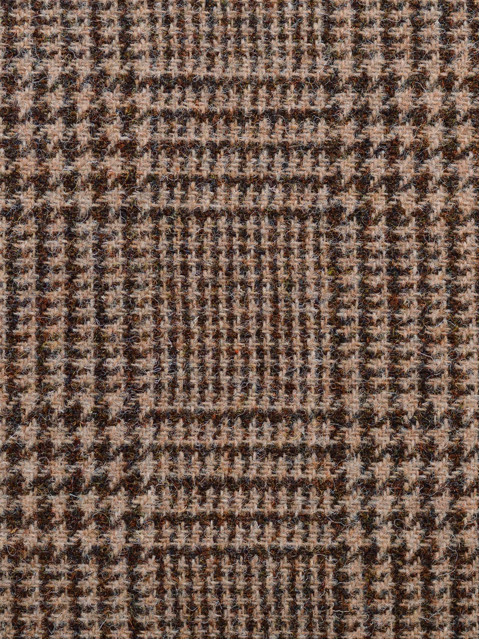 Close-up of Harris Tweed 79336 by Campbell's of Beauly, showing a brown and beige houndstooth pattern with intersecting lines and small checks—classic, woolly Scottish tweed often used for suits or coats.