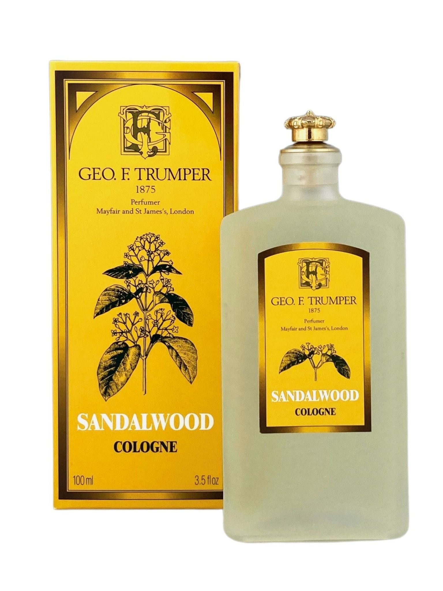 A frosted glass bottle of Geo. F. Trumper Sandalwood Cologne stands in front of its yellow and gold box with black botanical designs, labeled 100 ml (3.5 fl oz). This classic scent is crafted with Mysore sandalwood oil.