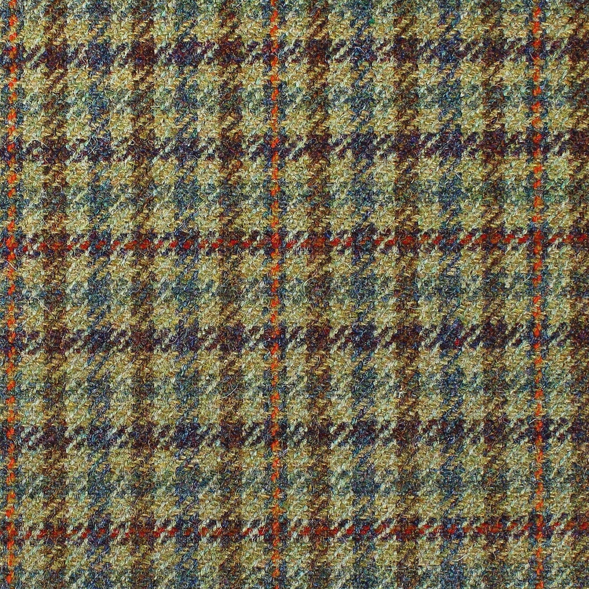 Estate Tweed 017 is a heavyweight wool cloth in a brown, green, and navy blue tweed check pattern, accented by thin orange vertical and horizontal lines.