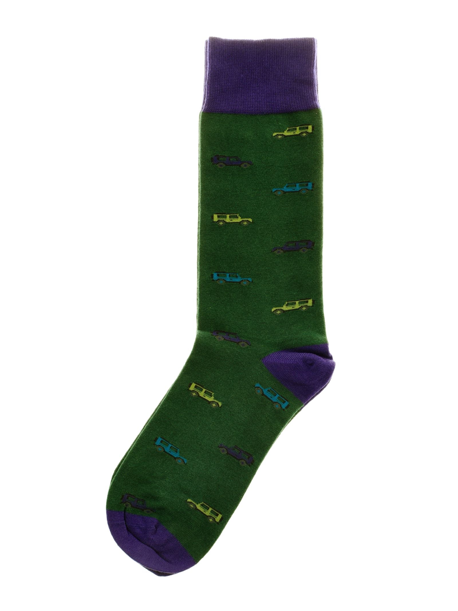 Land Rover Defender Socks by Campbell's of Beauly—green cotton with purple accents and a vibrant vintage car pattern, including Land Rover Defenders; the perfect gift for any Defender fan.