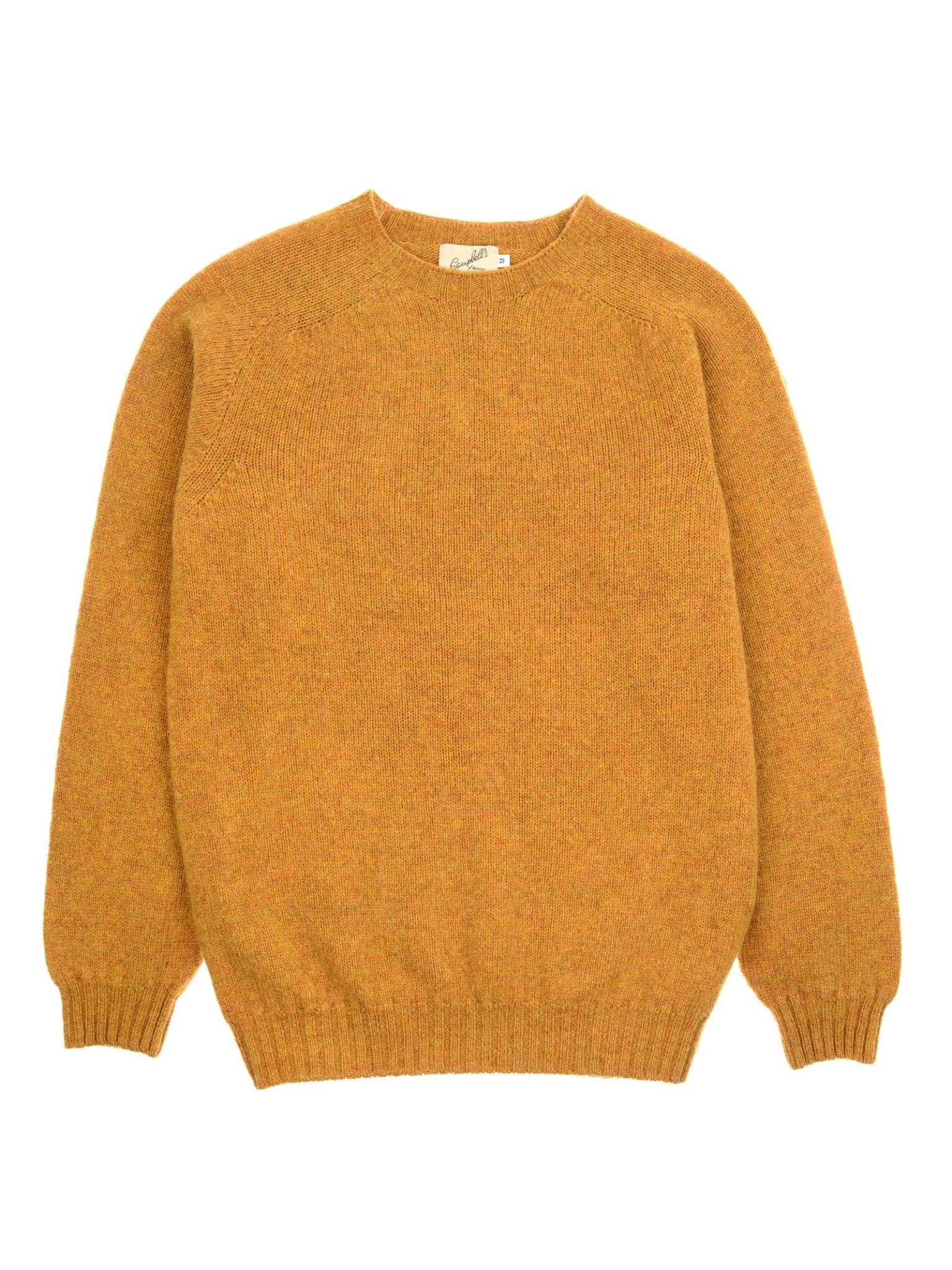 The Shetland Jumper by Campbell's of Beauly is a mustard yellow lambswool sweater with long sleeves, ribbed cuffs and hem, shown laid flat on a white background.