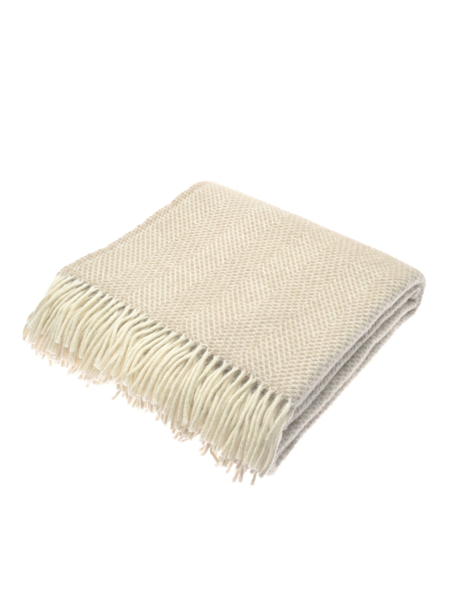 The Stipled Twill Blanket by Campbell's of Beauly is a beige wool blanket with a herringbone pattern, fringed edges, and a breathable weave, shown folded on a white background.