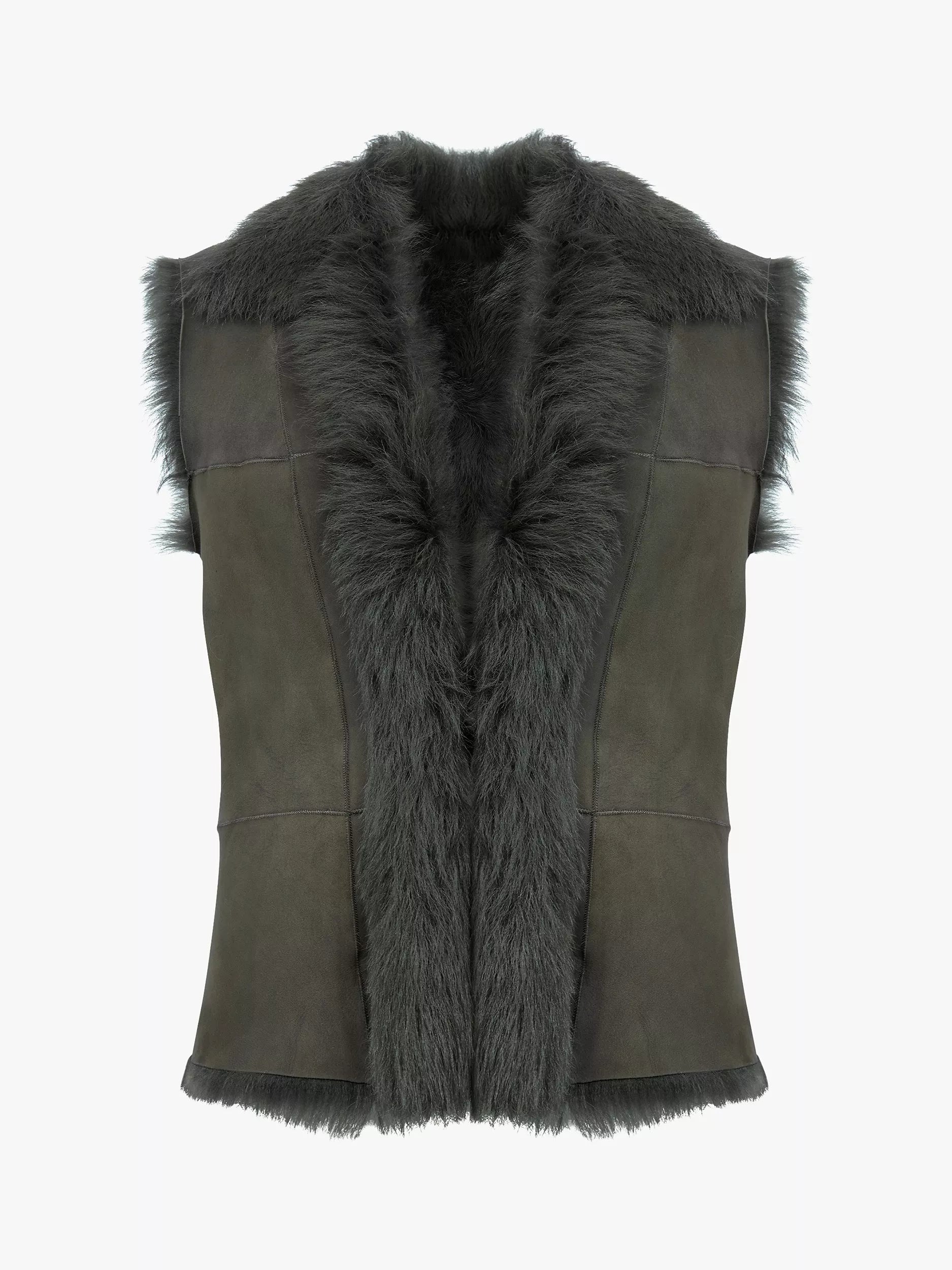 The Auld Stock Sheepskin Reversible Gilet by Campbell's of Beauly is a sleeveless dark gray vest with Toscana fleece collar and trim, tailored fit, panel detailing on the front, and finished with a suede tie.