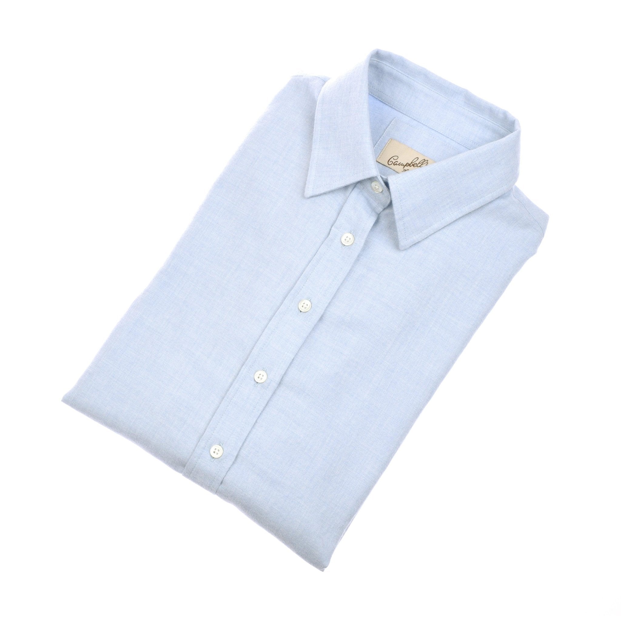 The Campbell's of Beauly Auld Stock Brushed Cotton Shirt in blue, classic fit with a pointed collar, is neatly folded and displayed against a white background.