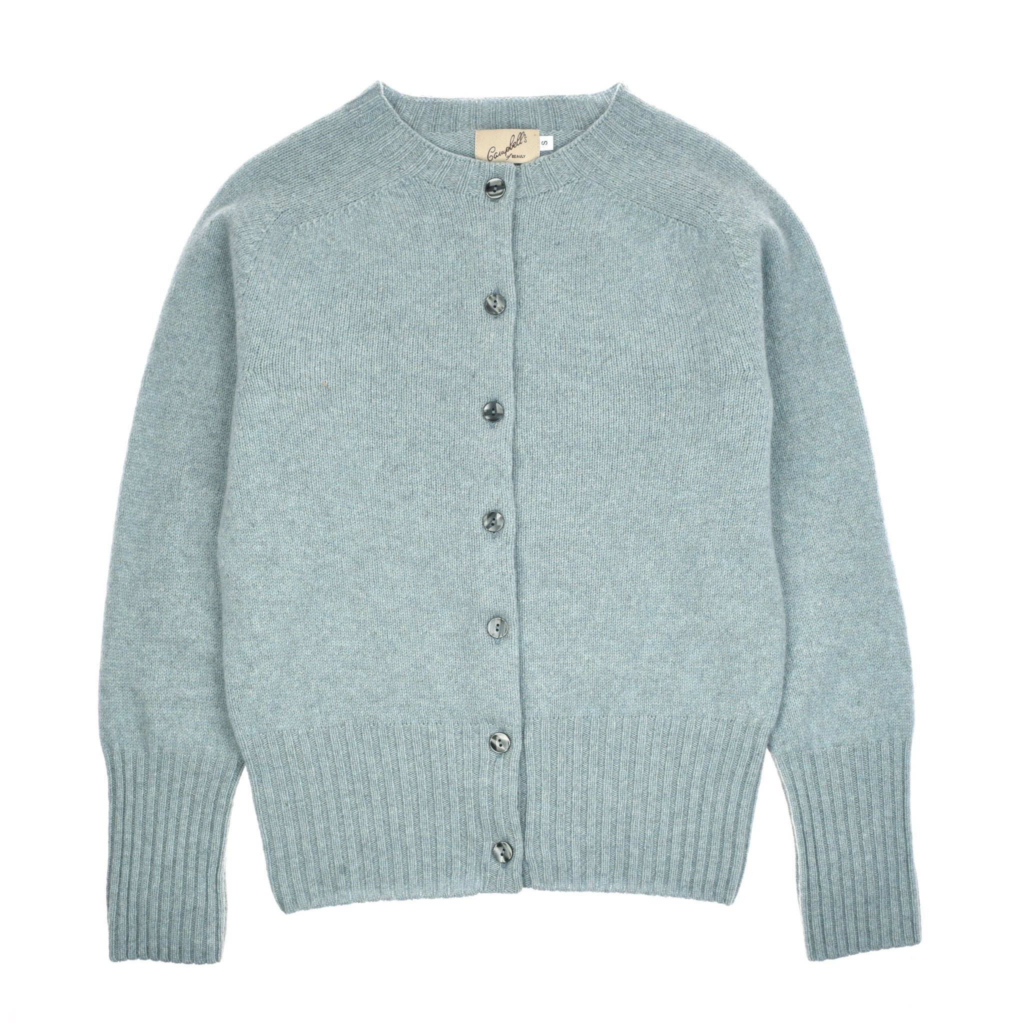 The Geelong Lambswool Crew Cardigan by Campbell's of Beauly is a light blue, long-sleeve crew neck made in Scotland with ribbed cuffs and hem, featuring seven round buttons down the front, shown laid flat on a white background.