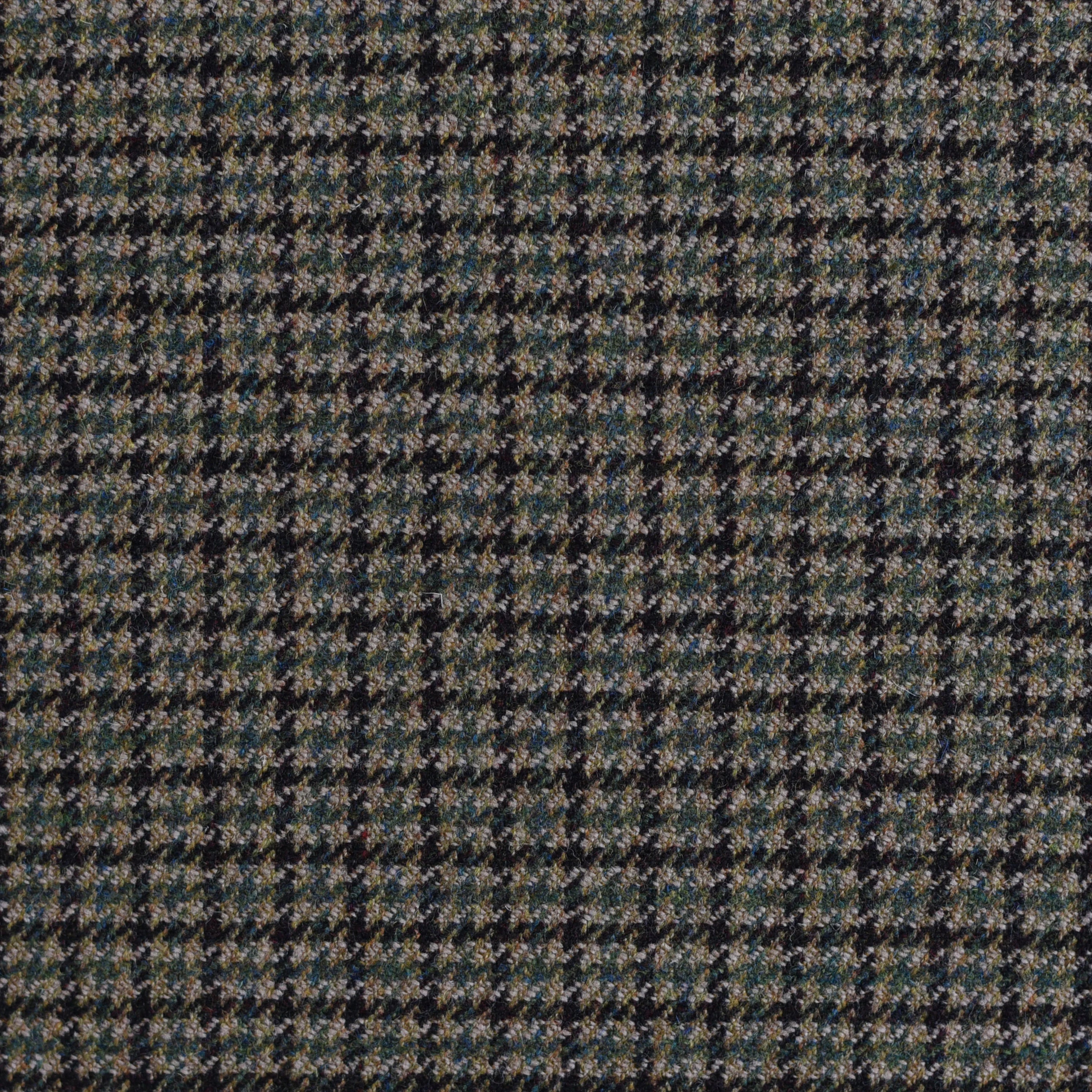 A close-up of House Tweed 75369 fabric by Campbell's of Beauly shows a black, white, and gray check pattern with small geometric shapes, evoking classic Scottish tweed style. Available by the metre.