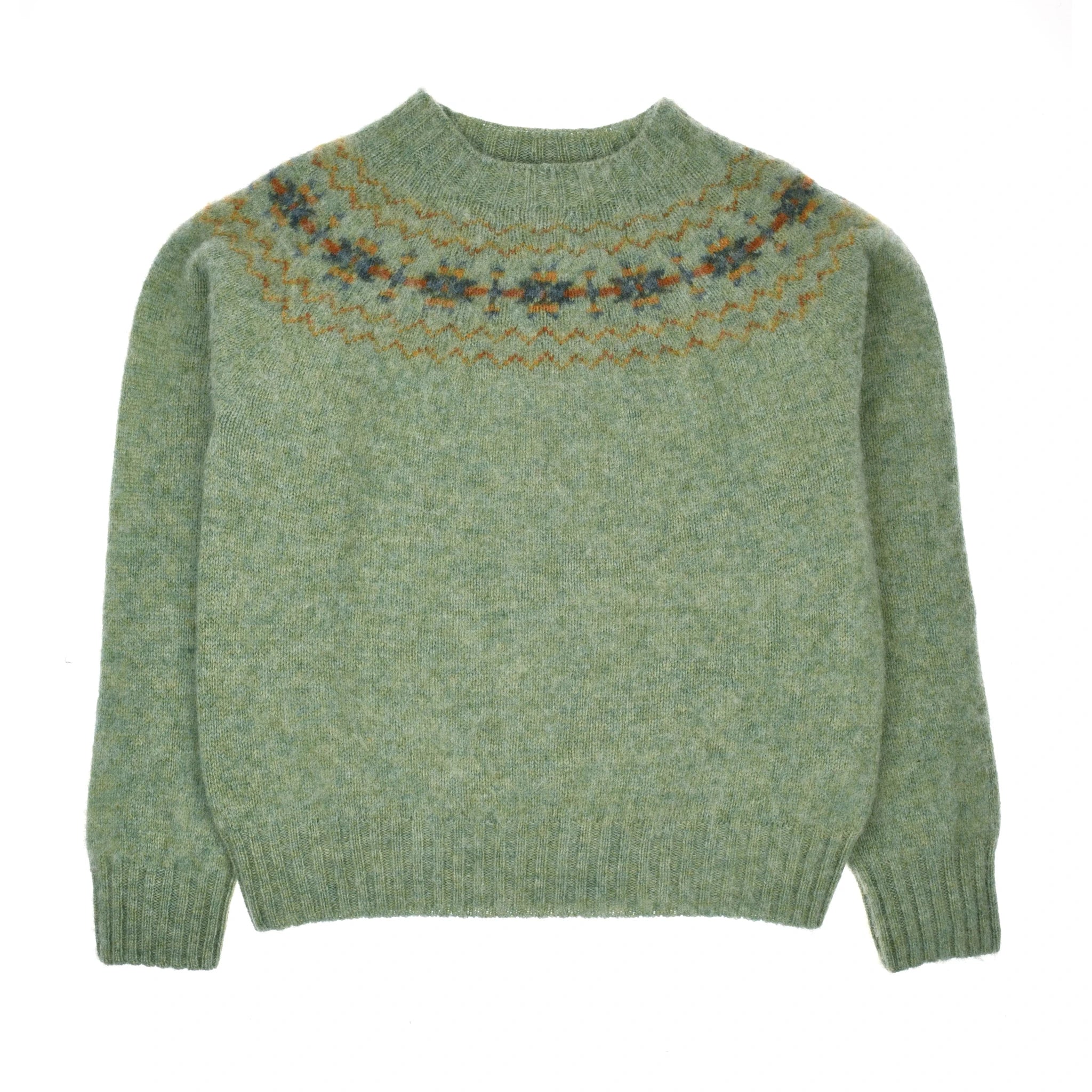 The Auld Stock Cropped Fairisle Crew Neck Jumper by Campbell's of Beauly is a light green Pure New Wool sweater with long sleeves and a classic multicolored Fair Isle pattern around the upper chest and shoulders.