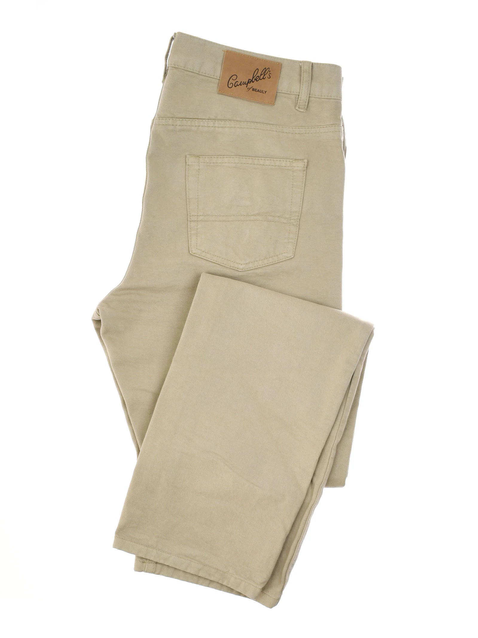 A folded pair of Neutral Cotton Jeans from Campbell's of Beauly, featuring tan canvas cotton, a five-pocket design, and a branded leather patch on the back pocket.