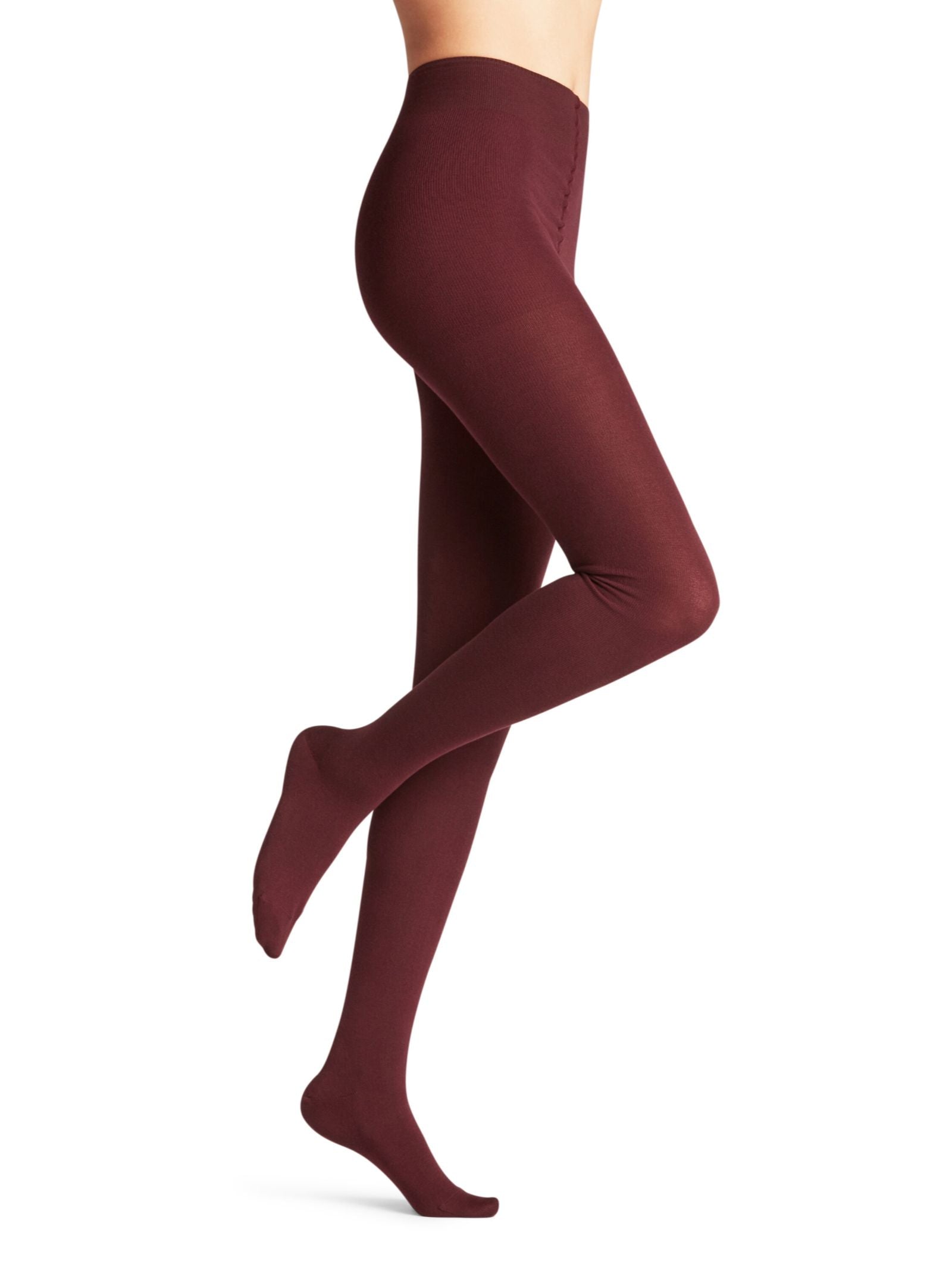A person models FALKE Cotton Tights in burgundy, standing on one leg with the other slightly bent against a plain white background; only part of their upper body is visible.