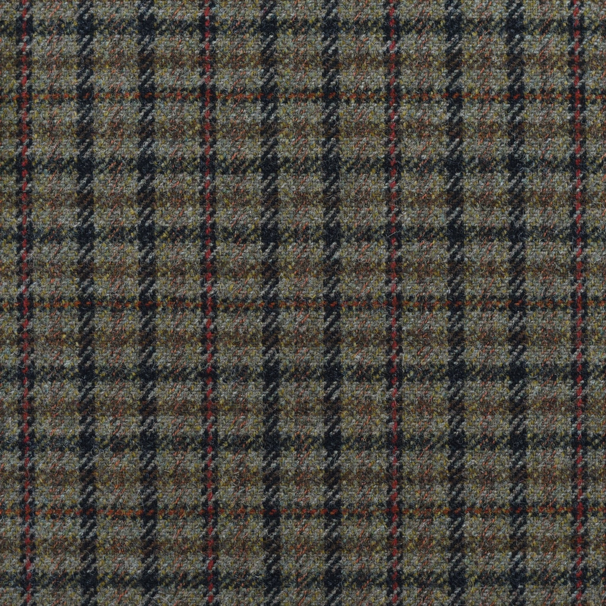 Campbell's of Beauly House Tweed 30001 is a brown and gray Scottish tweed fabric with a classic plaid featuring black, blue, and red lines. Soft and slightly fuzzy, it’s perfect by the metre for your next project.