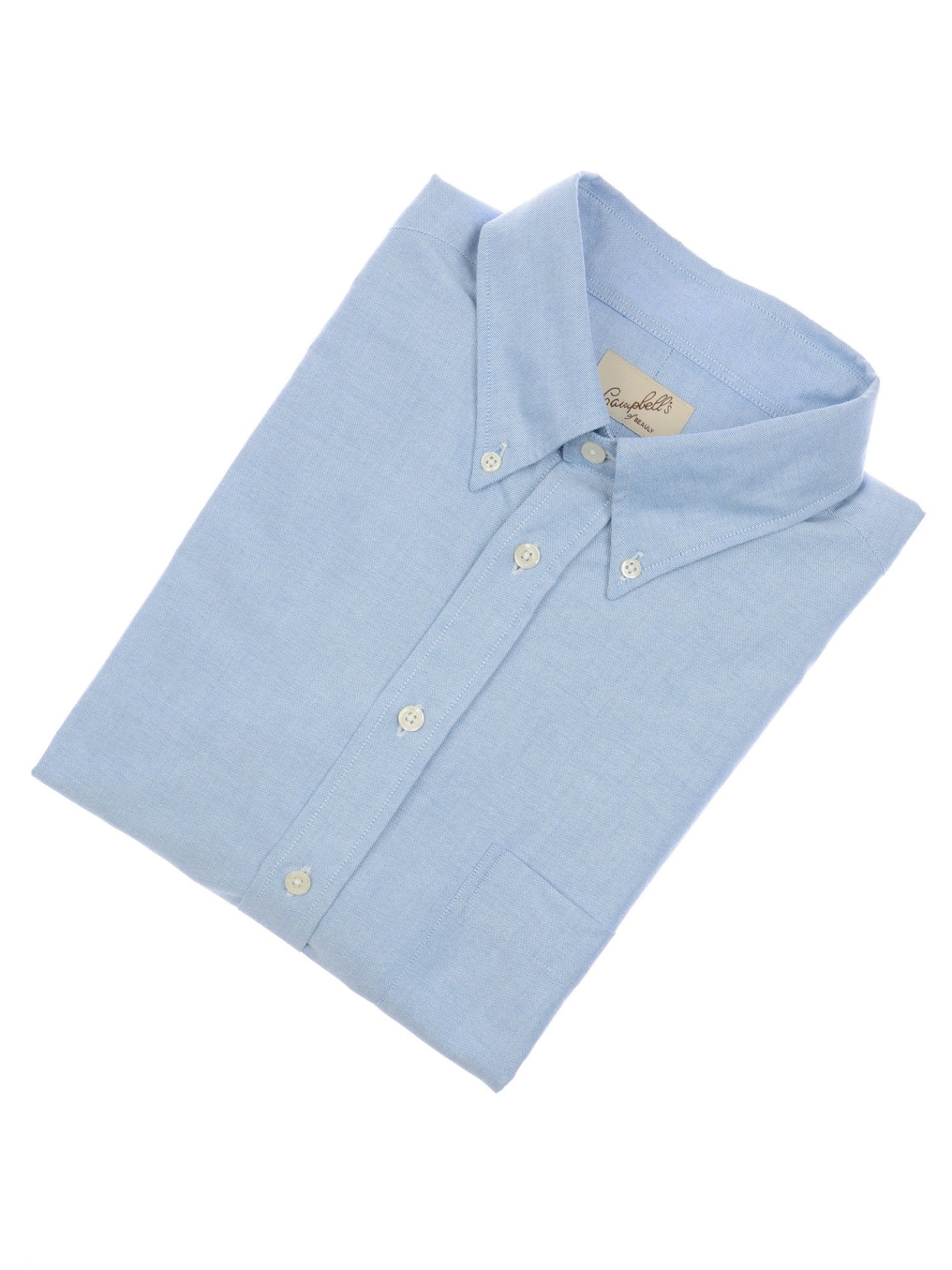 The Campbell's of Beauly Oxford Button Down Shirt in light blue cotton, with long sleeves, white buttons, and a front pocket, is neatly folded on a white background—ideal for summer or classic shirt collections.