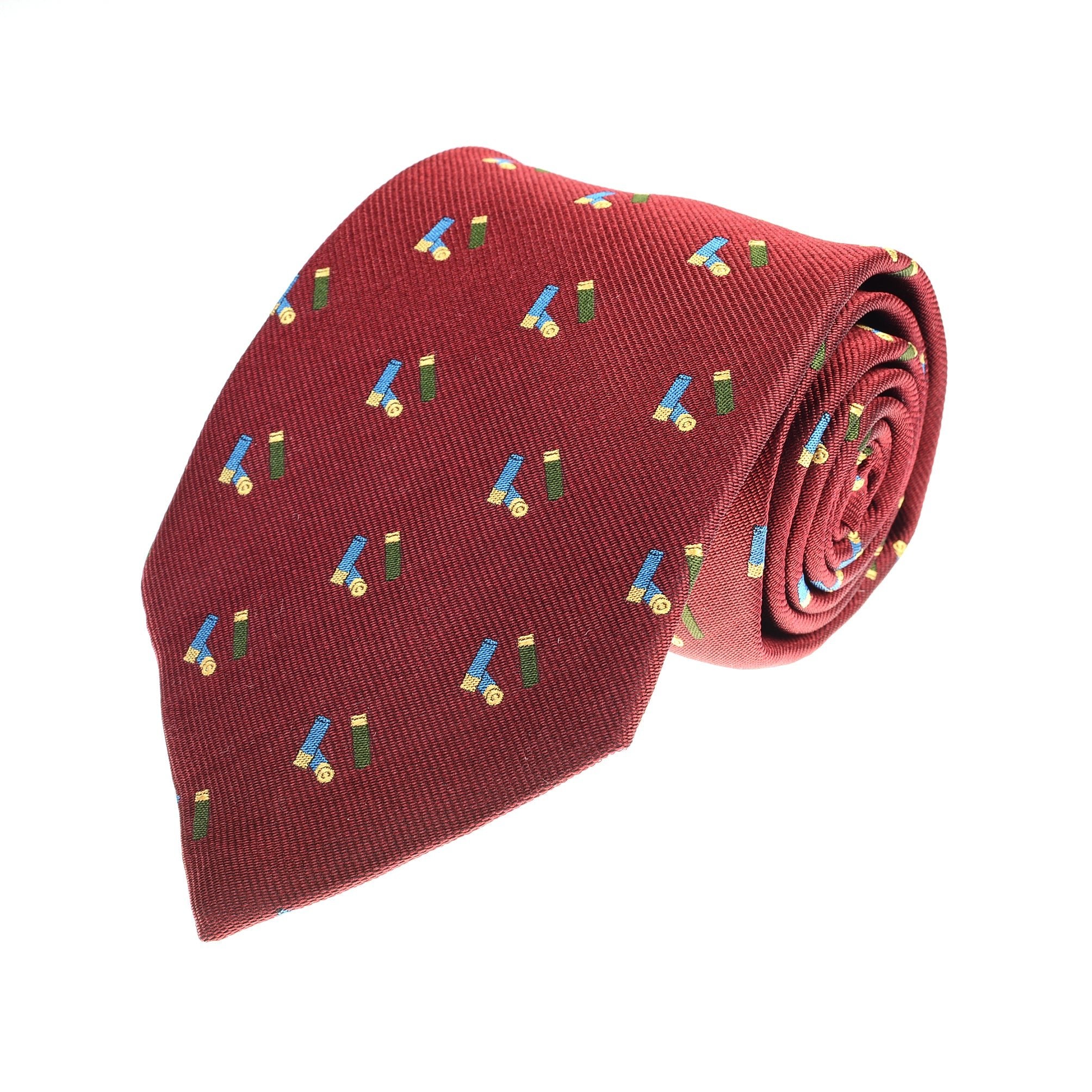 The Auld Stock Cartridges Silk Tie by Campbell's of Beauly is a rolled red silk tie featuring a repeating cartridge pattern on a white background—perfect for adding character to your shooting outfit.