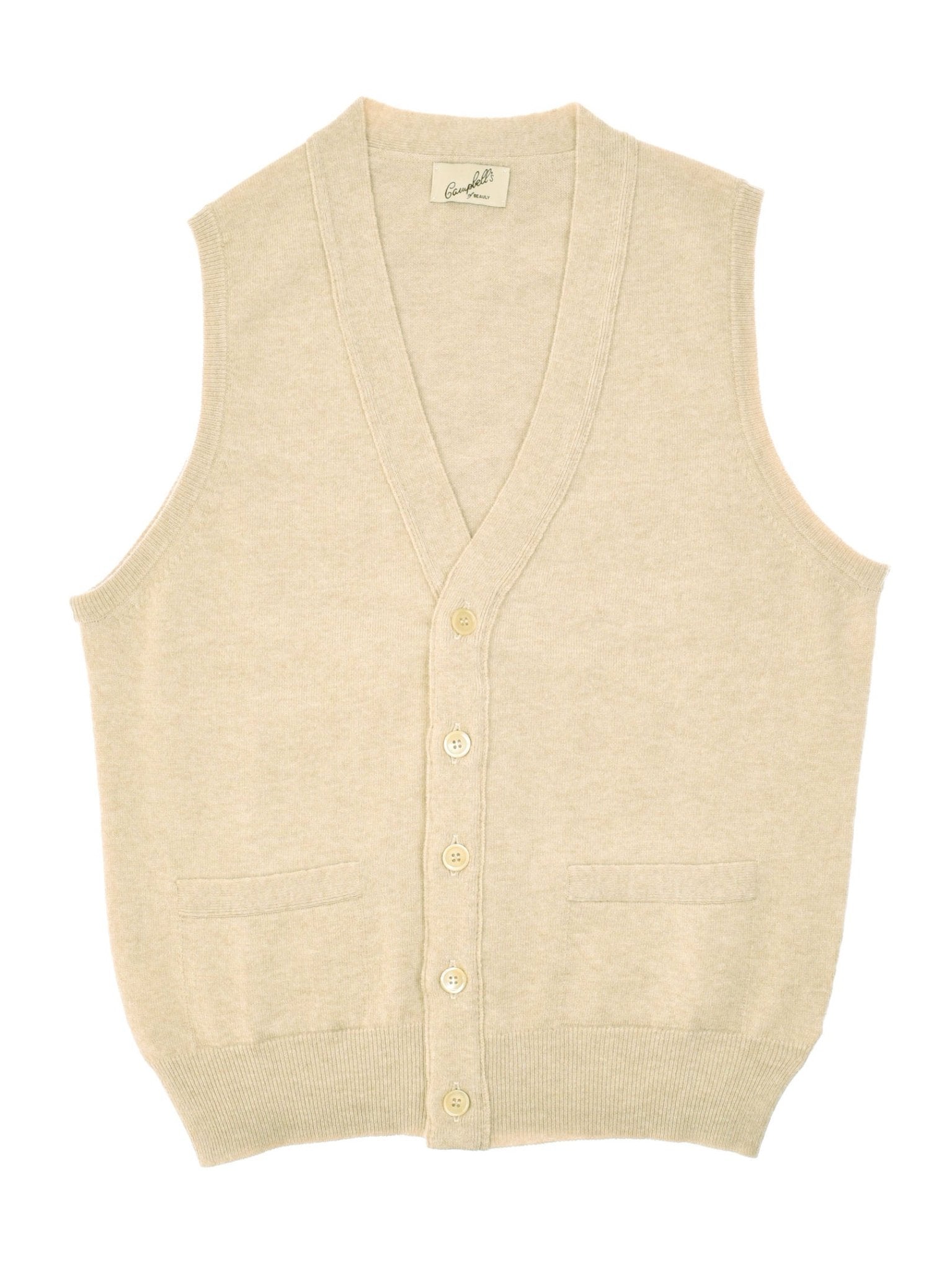 The Campbell's of Beauly Geelong Button Waistcoat is a beige, sleeveless merino wool vest with a V-neck, button-down front, two small front pockets, and a ribbed hem.
