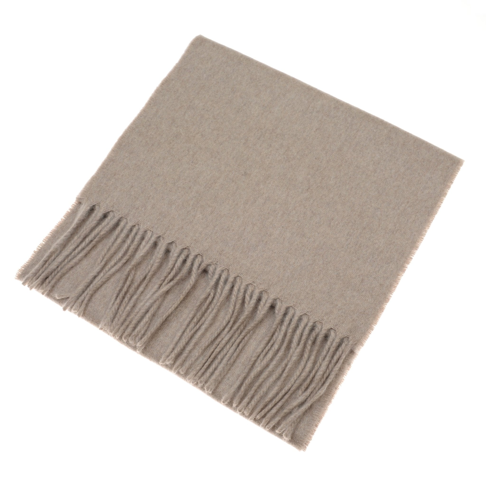 A folded light brown Unisex Cashmere Scarf by Campbell's of Beauly, featuring fringed edges and displayed on a white background—a timeless luxury accessory.