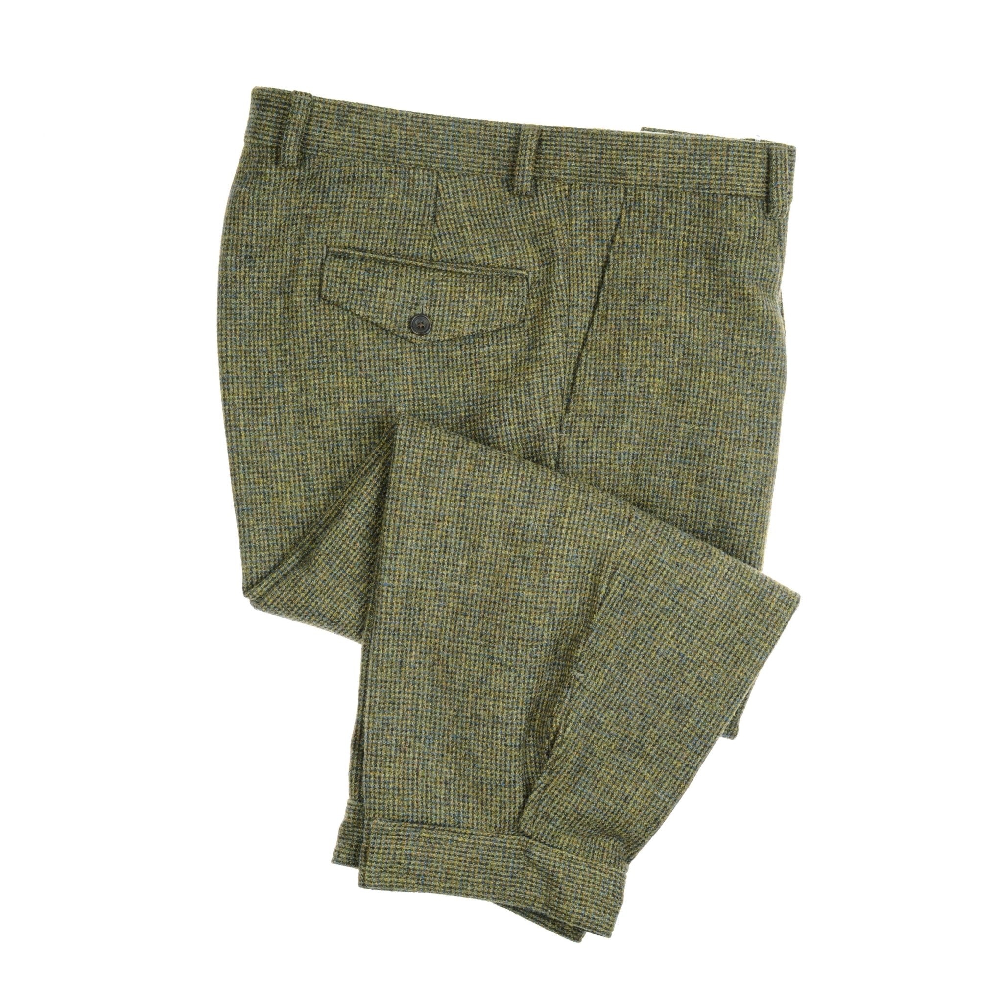 A pair of green and brown checkered Tweed Breeks by Campbell's of Beauly, neatly folded to show the buttoned back pocket flap, evoke classic country style against a white background.