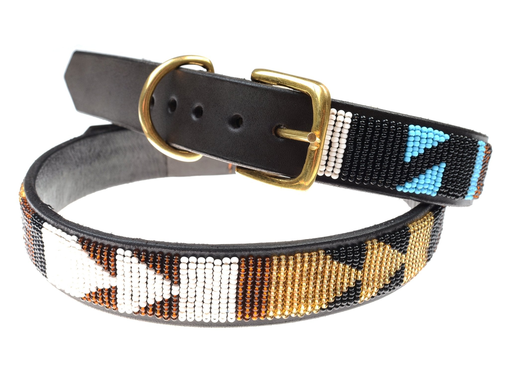The Auld Stock Dog Collar by Campbell’s of Beauly features black leather, a brass buckle, and intricate geometric beadwork in white, brown, gold, and blue—showcasing a striking handmade design.