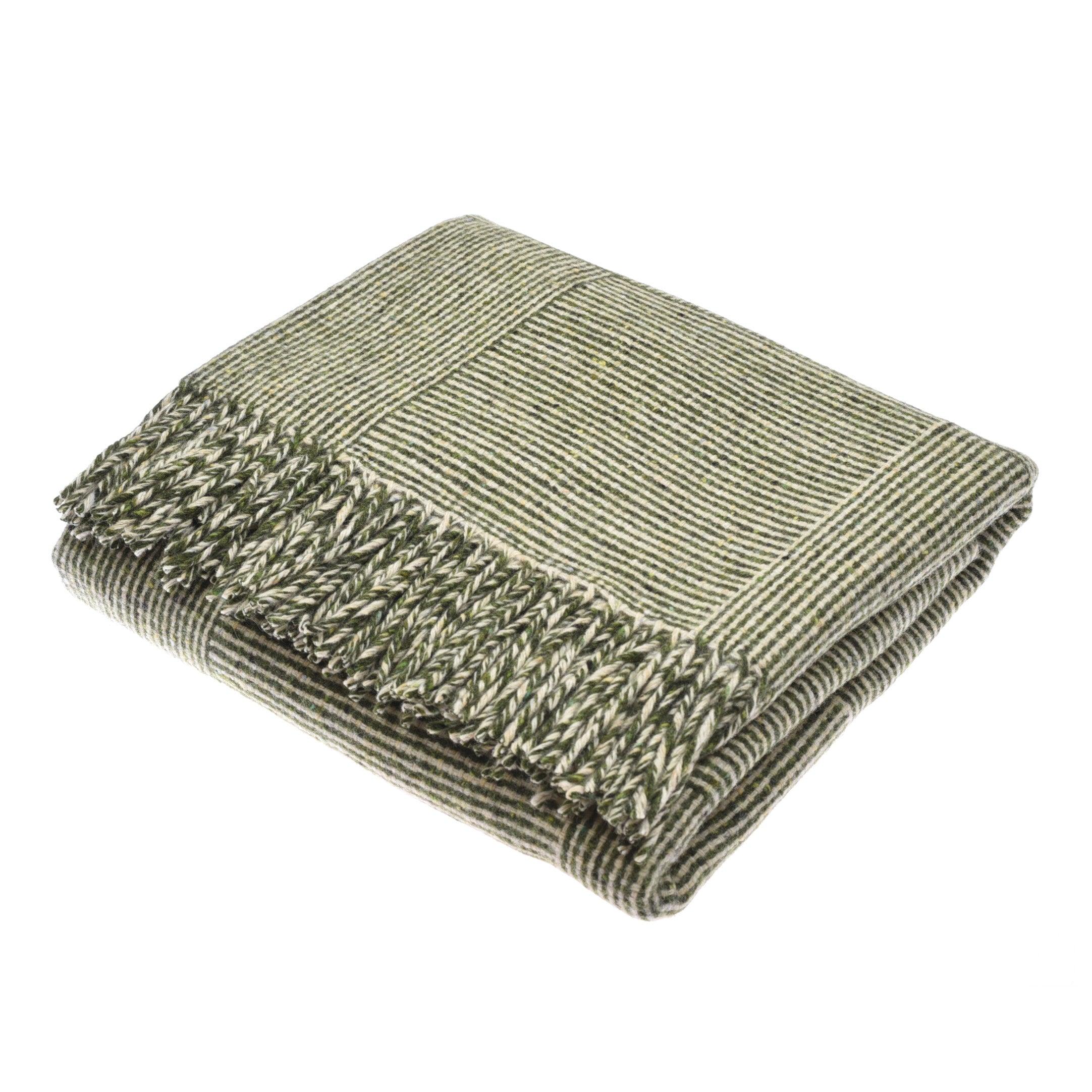 The Cabrich Lambswool Throw by Campbells of Beauly, in moss green with beige stripes and a tasseled fringe, features a subtle basket weave pattern and is neatly displayed on a white background.