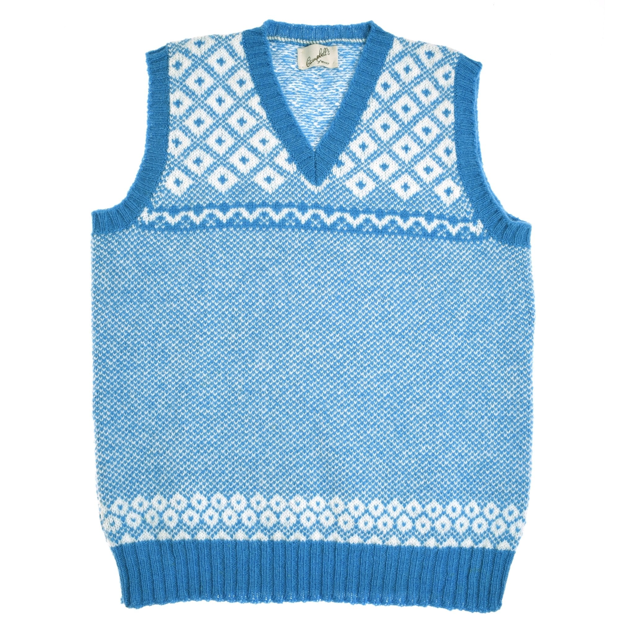 The Auld Stock Nordic V Tank by Campbell's of Beauly is a blue knitted sleeveless vest featuring white Fair Isle-inspired diamond and dot patterns around the chest and hem, finished with a classic V-neck.