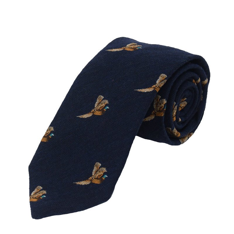 The Campbells of Beauly Pheasant In Flight Silk Tie in navy features embroidered brown pheasants and is handmade from premium silk.