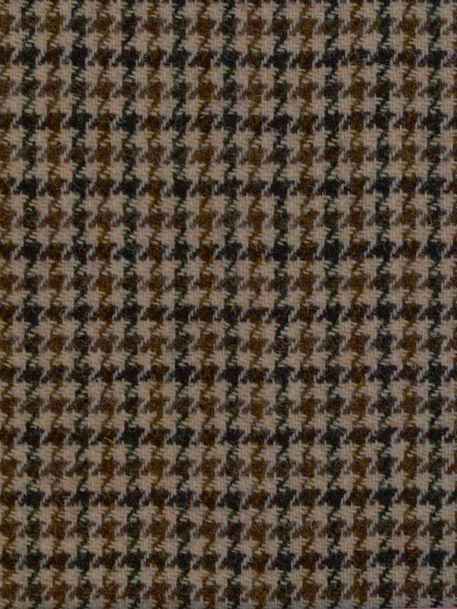 Close-up of Harris Tweed 93909 by Campbell's of Beauly, featuring a houndstooth pattern in brown, beige, and black—showcasing the classic Scottish broken check design in premium lightweight tweed.