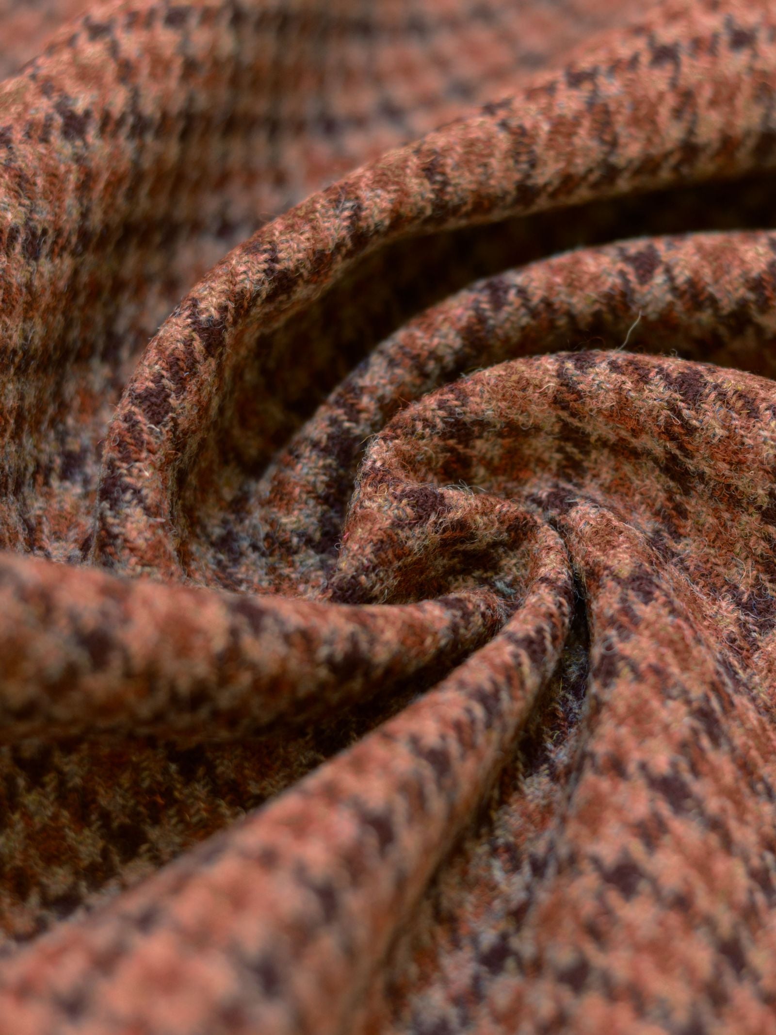 A close-up of the House Tweed 93910 fabric by Harris Tweed highlights its intricate texture and reflects the rich tradition of Scottish weaving.
