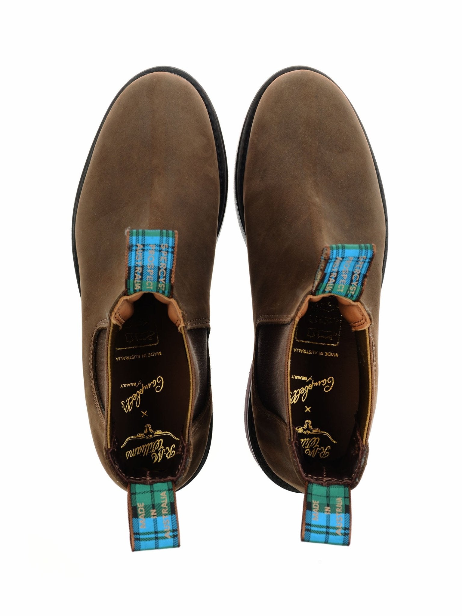A top view of the Men's R.M.Williams Highlander Boot in brown leather with blue plaid pull tabs, from the R.M.Williams x Campbell's of Beauly collaboration, set against a white background.