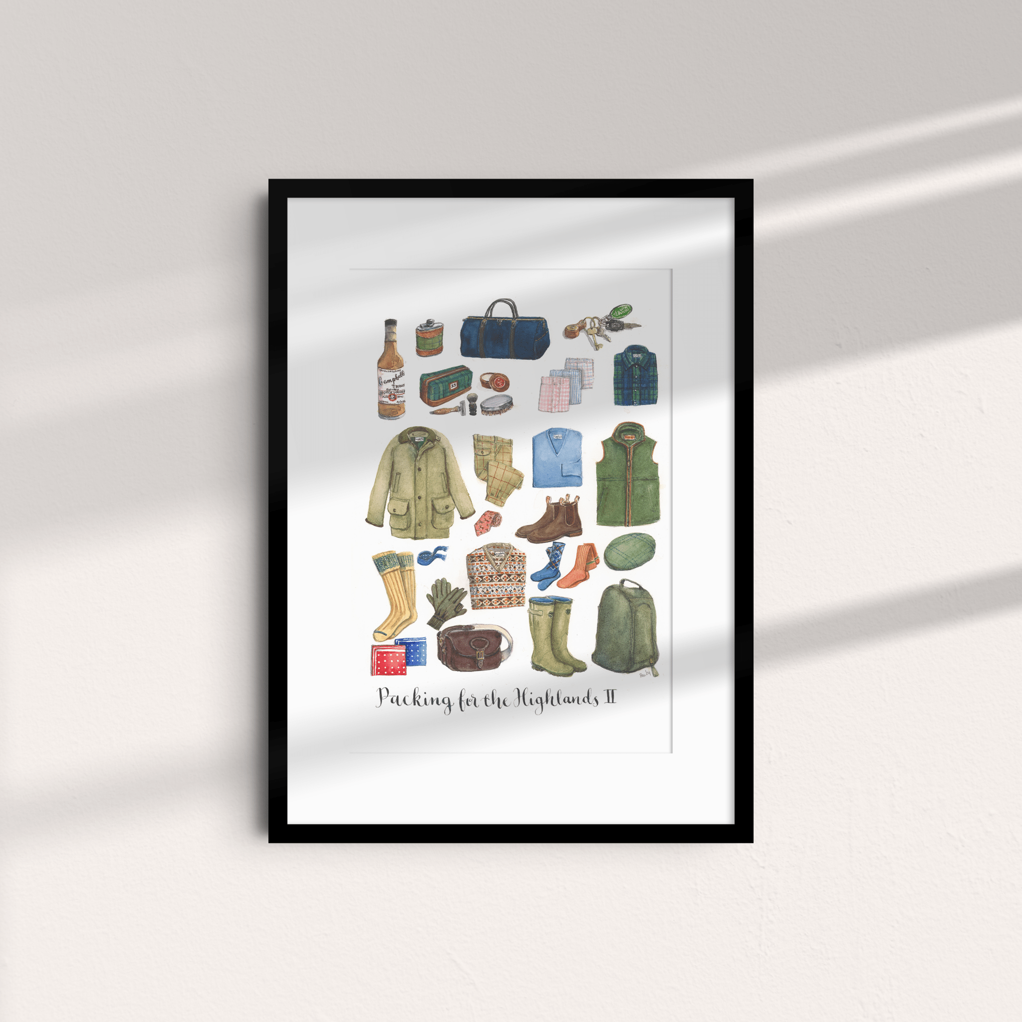 A mounted Campbell's of Beauly unframed print, "Packing for the Highlands 2," features watercolor illustrations of travel essentials—jackets, bags, boots, socks, food, and gifts—against a light wall.