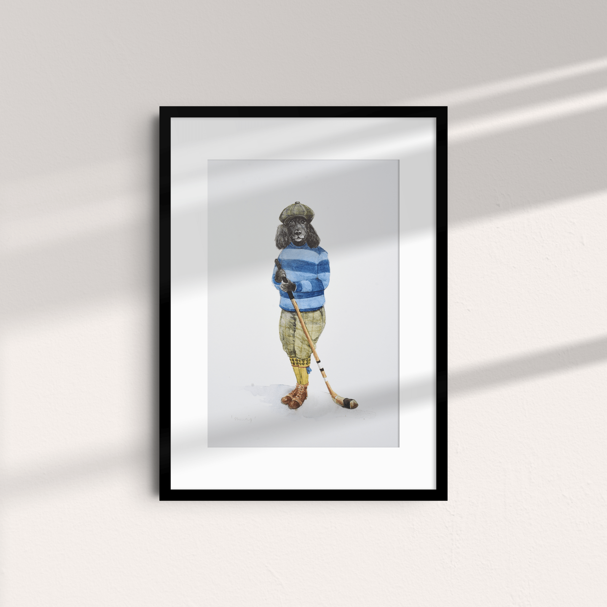 The Shinty Player Unframed Print by Campbell's of Beauly features a dog in a cap, blue striped sweater, and yellow pants holding a hockey stick—sunlight casts shadows, evoking the classic Campbell’s of Beauly style.