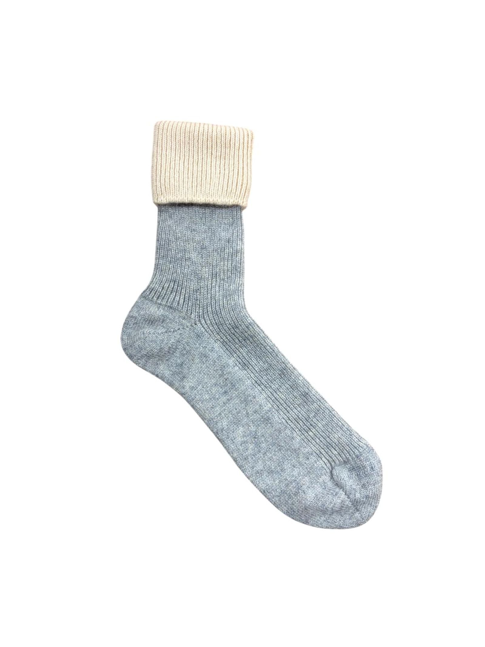 A single Campbell’s of Beauly Cashmere Contrast Sock in gray, featuring a thick, ribbed, cream-colored fold-over cuff, is displayed on a plain white background.