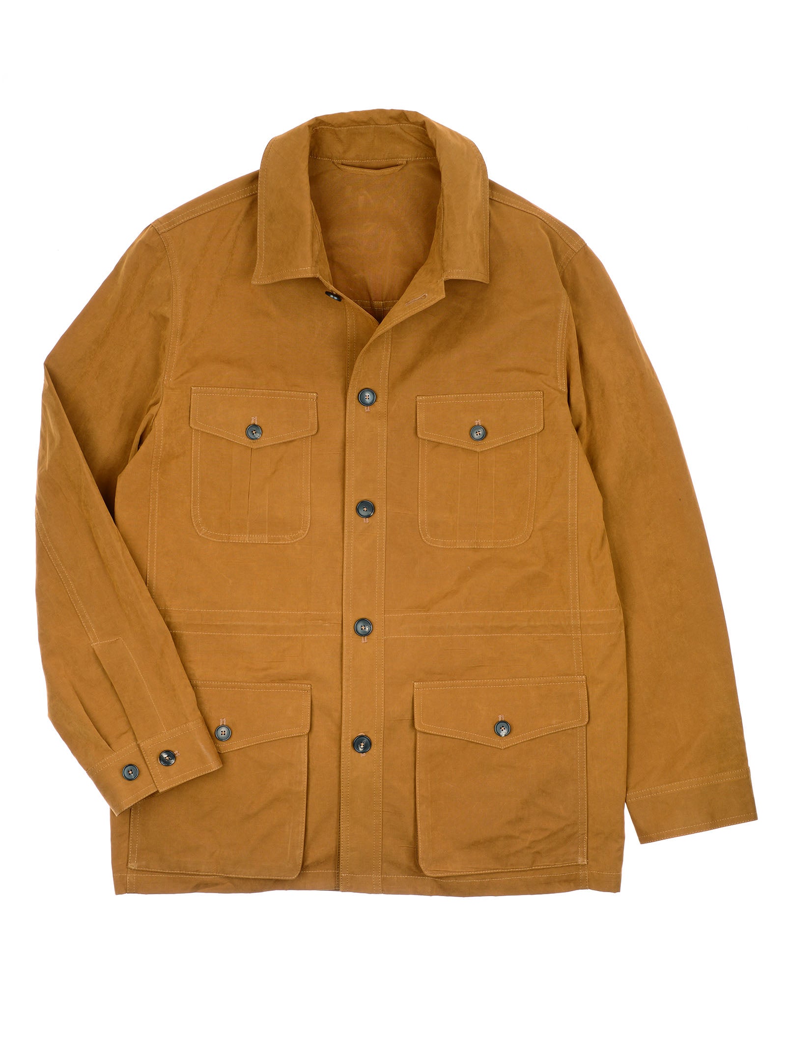 The Aigas Field Jacket by Campbell's of Beauly features tan peach skin canvas, button-up front, two chest and two lower front flap pockets with buttons, long sleeves, and a collar. Shown laid flat on a white background.