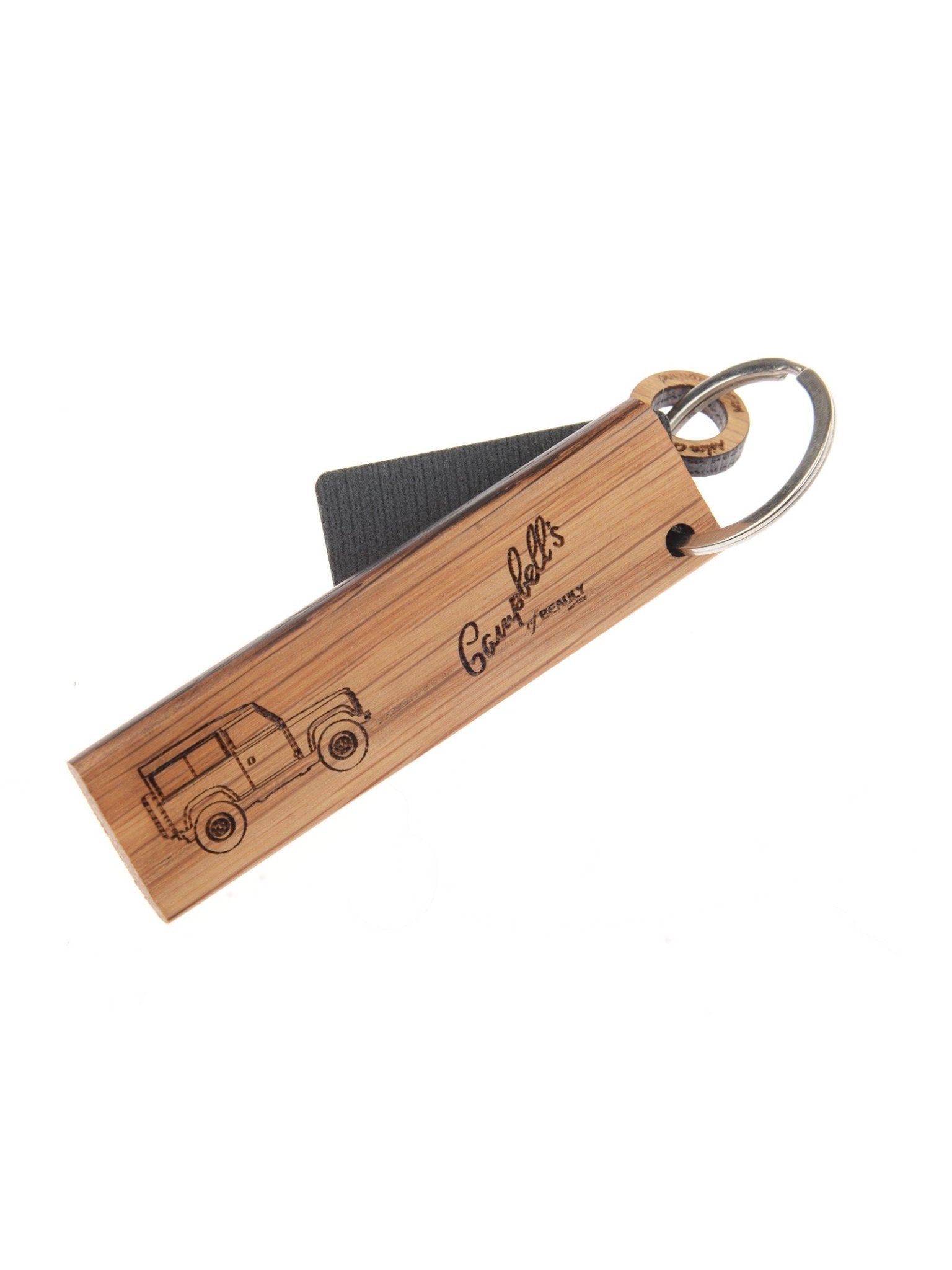The Campbell's of Beauly Whisky Barrel Keyring features a rectangular oak piece from whisky barrels, engraved with a Land Rover Defender, and is attached to a metal ring with a black strap.