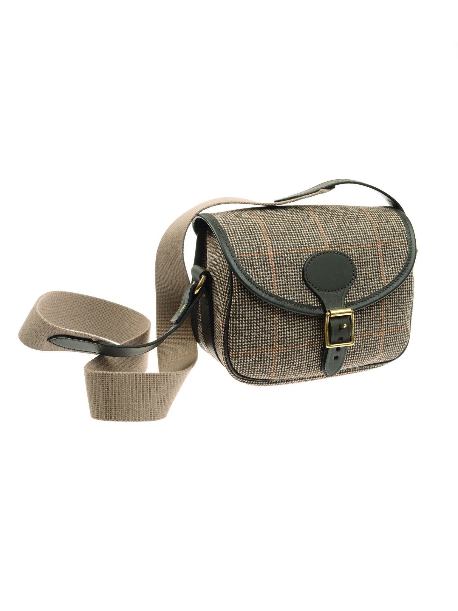 The Cartridge Bag, Kirkton 523 by Campbell’s of Beauly is a compact crossbody crafted from Scottish plaid tweed with dark green leather trim, a front buckle closure, and a wide beige adjustable strap inspired by classic speed-load design.
