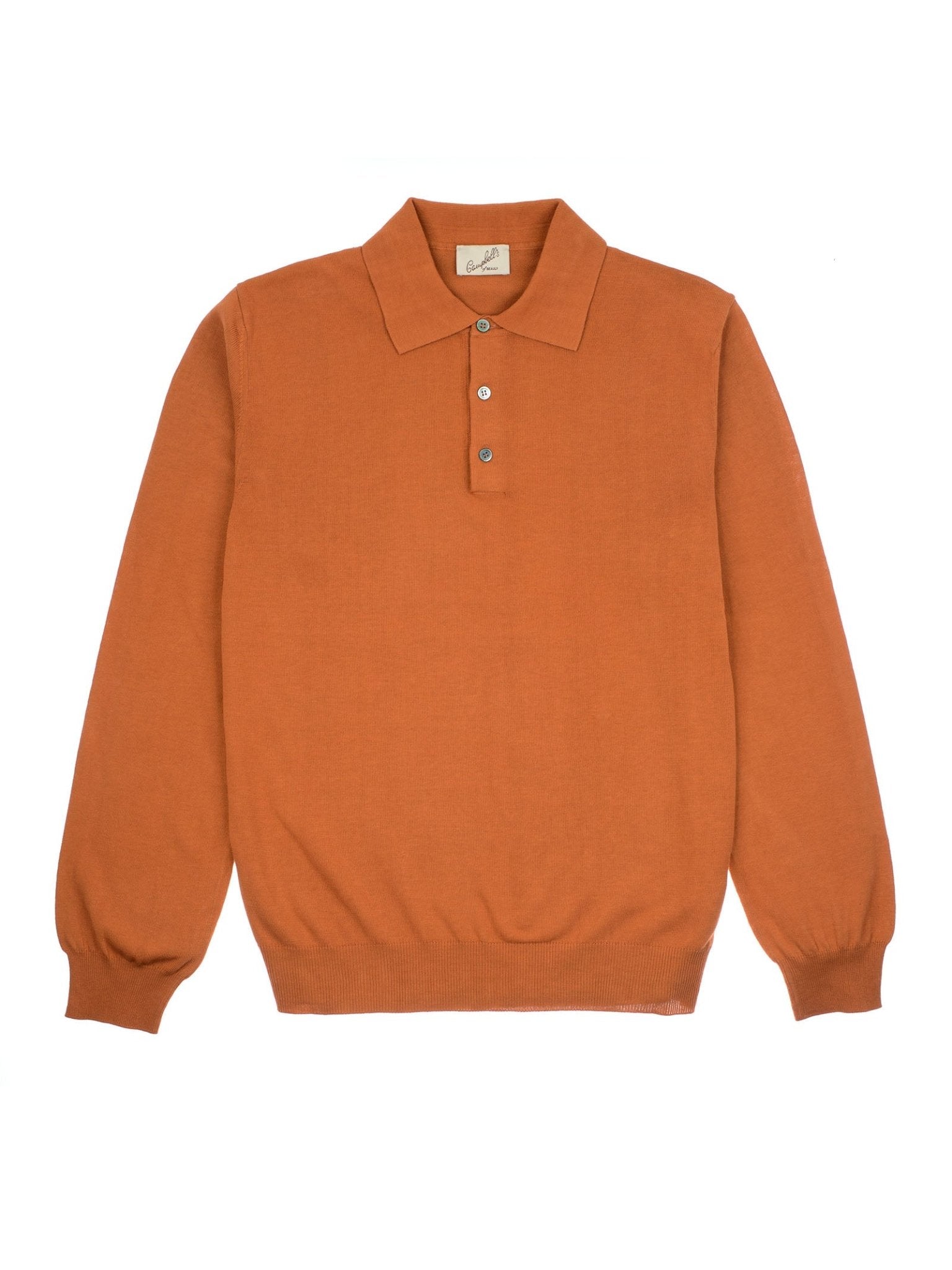 The Campbell's of Beauly Cotton Rugby is a rust-orange, long-sleeve knit polo with a collar, three-button placket, ribbed cuffs and waistband, made from premium Egyptian cotton, shown laid flat on a white background.