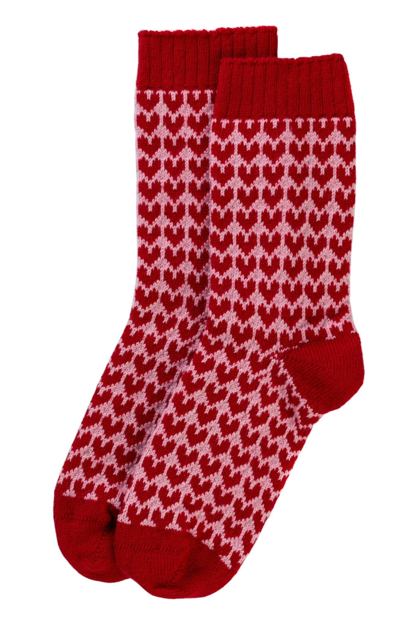 Campbell’s of Beauly Cashmere Heart Socks in red, featuring a delightful pattern of small pink hearts across the body. The toes, heels, and cuffs are finished in solid red for contrast, while the rest of these cozy socks showcase the repeating heart motif. The socks are displayed flat against a white background.