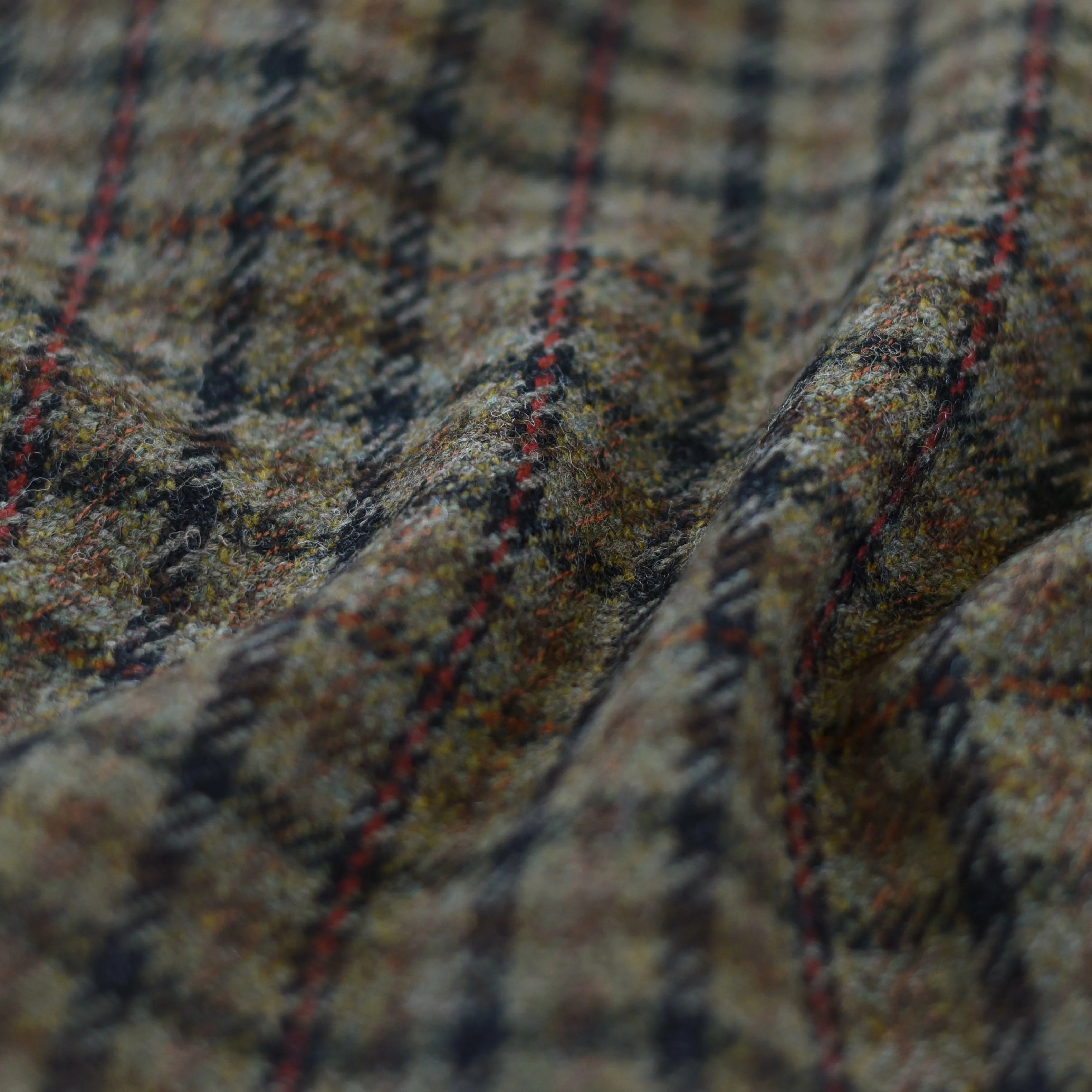 A close-up of House Tweed 30001 by Campbell's of Beauly, showcasing classic plaid in muted earthy tones with navy blue, red, and brown lines. This soft, textured Scottish wool tweed is available by the metre.