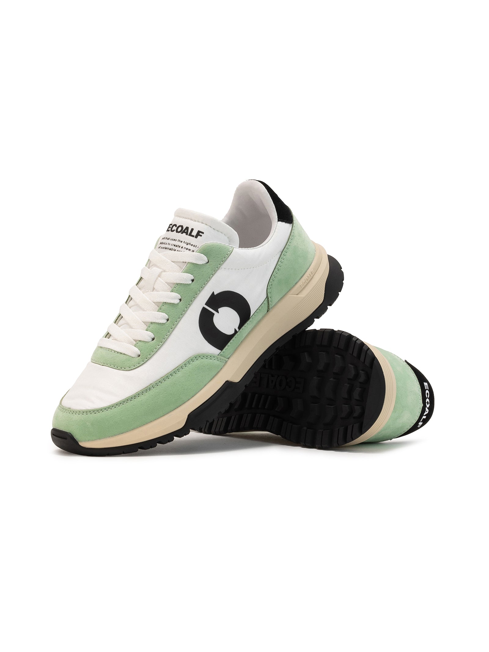 The Ventura Trainers by ECOALF come in green with black soles, made from recycled polyester. One shoe stands upright while the other leans against it, displaying the brand logo and ECOALF on the tongue.