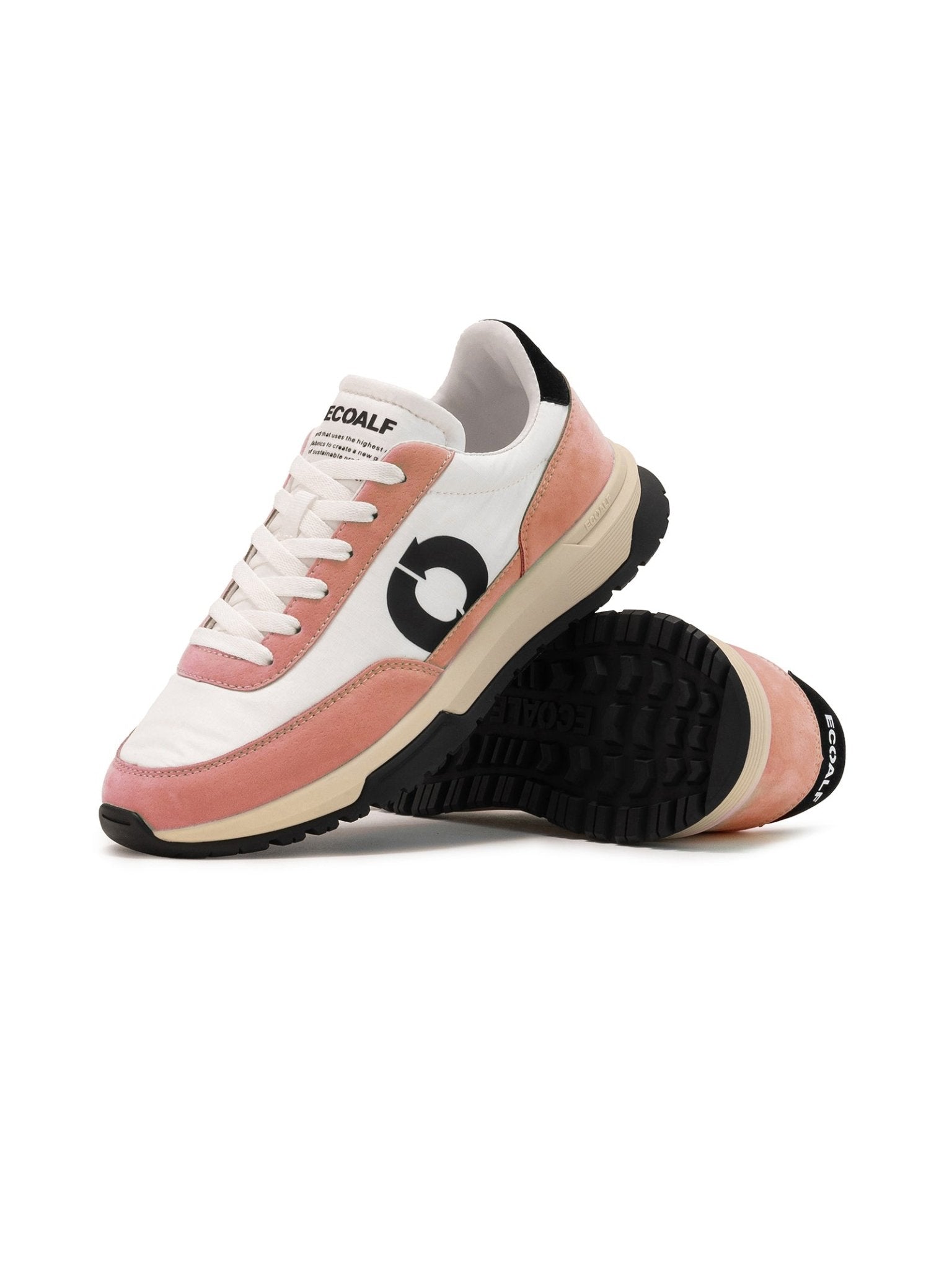 A pair of ECOALF Auld Stock Ventura Trainers featuring white uppers, light pink vegan suede accents, black soles, and a bold black circular logo on the side. One shoe stands upright; the other displays its sole.