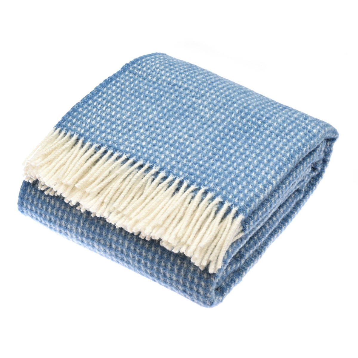 The Campbells of Beauly Honeycomb Lambswool Throw in Sky features a blue and white houndstooth pattern with a cream fringe, shown folded on a white background.